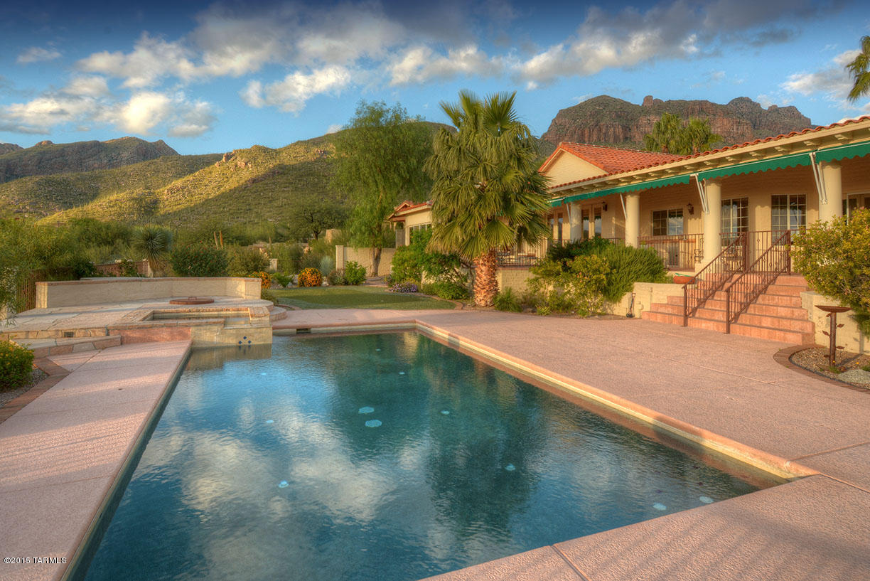 Unparalleled views of the Tucson city lights, Catalina Mountains from this very special 5 bedroom 6 bath home in prestigious Cobblestone. Wonderful kitchen with granite, island and top of line appliances.  Wine room, media room, exercise room, guest wing. Lux mastersuite with large walk-in closet. Truly resort-like living outdoors with pool, spa putting green, deep covered patio and views forever.
