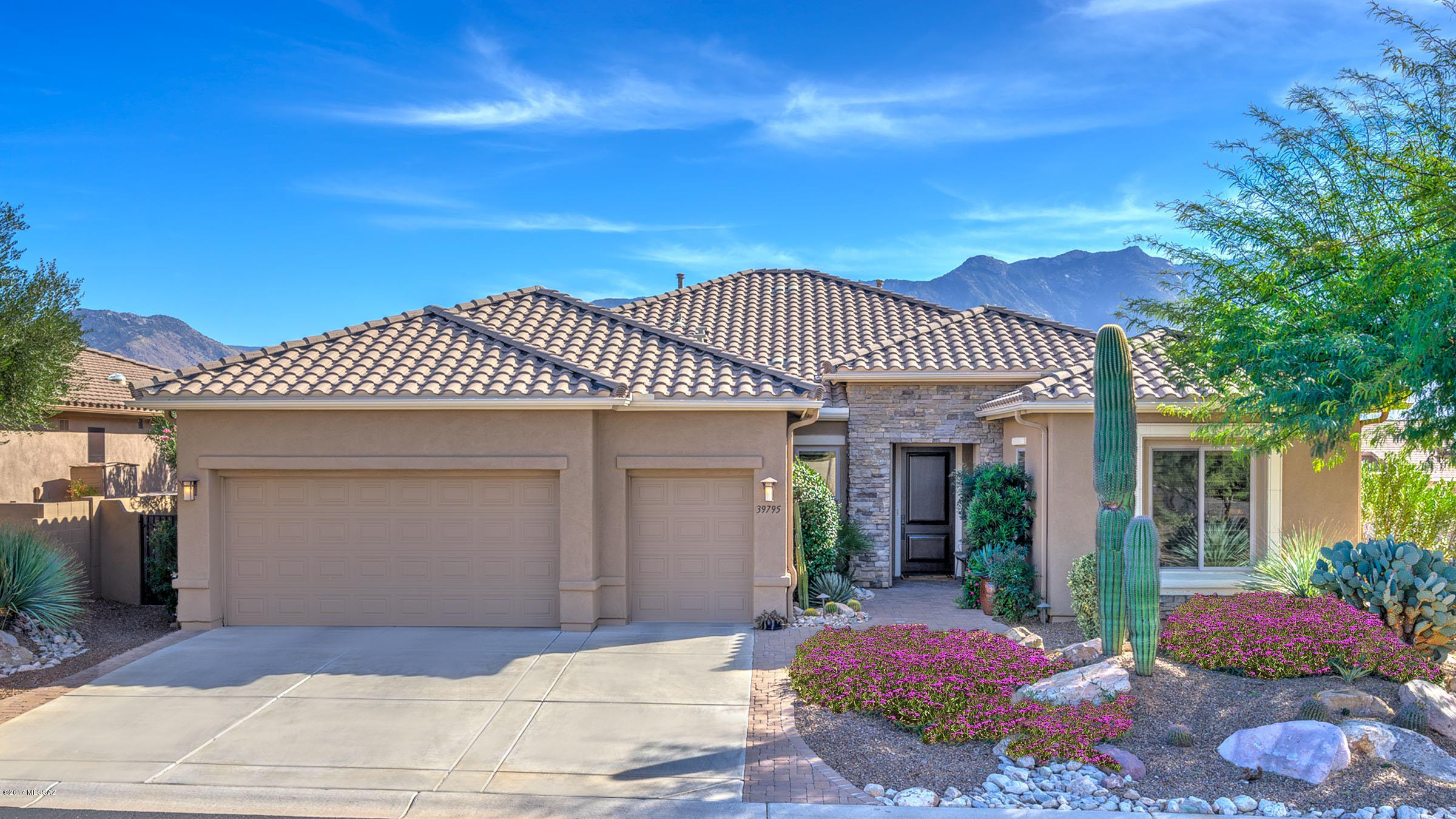 Beautiful great room with sweeping views welcomes you when you walk into this designer quality Cabrillo model.  This rare model features a spacious greatroom w/a gas fireplace, custom built-in entertainment center with plenty of room for large screen TV & is open to the beautiful kitchen with granite counters, stainless appliances including a gas cooktop. The mountain views form the backdrop for the open dining room. Master suite w/en-suite boasting dual vanities, tub & separate shower plus large walk-in closet. 2 guest suites with private en-suites, den with custom built-ins, convenient powder room, plus 3rd car garage. Outside, highly expanded wrap around paver patio with built-in BBQ is an ideal entertaining spot for enjoying the mountain views & the best of the SaddleBrooke lifestyle.