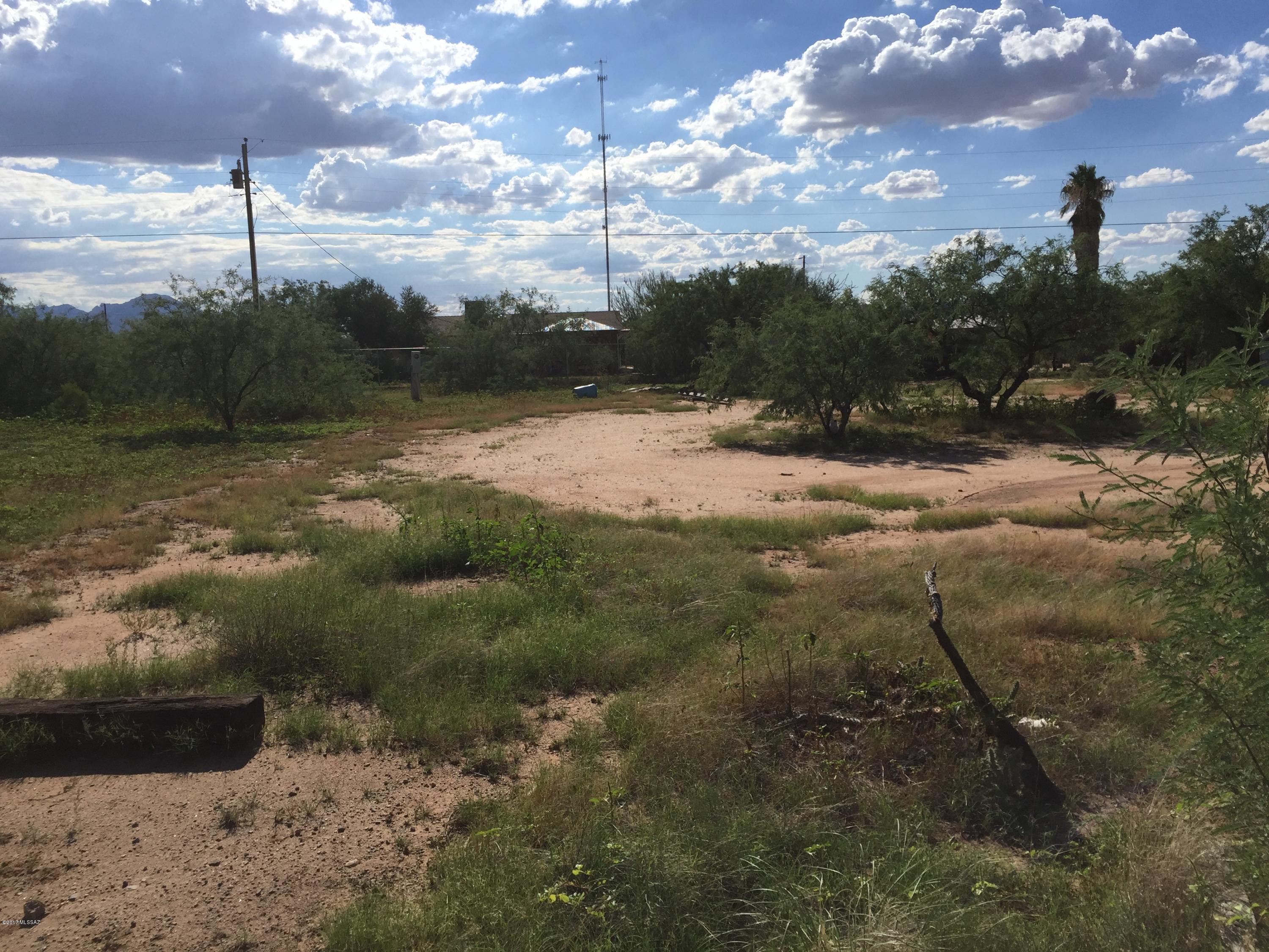 Ready to build or pull a manufactured home on it.  Paved Streets.  Power and water on site.  Buy all 3 lots nd live on one and develop the other two.  Southern most lot of the 3 listed by the Esala Team.