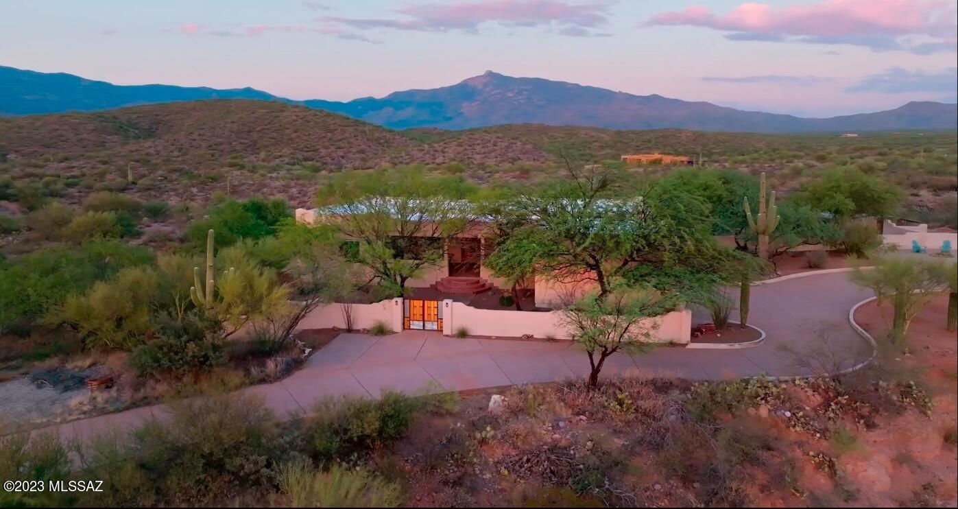 SELLER TO CREDIT 10K TO BUY DOWN RATE OR USE TOWARDS CLOSINGS COSTS WITH ACCEPTABLE OFFER - AND PRICED BELOW RECENT APPRAISAL ($825k)! Perched atop a scenic hill, this property encompasses 6 fully fenced acres of serene land, presenting an undeniable allure that demands your attention. Be sure not to miss the captivating showcase video, which offers a comprehensive view of its remarkable features. The dedication of the owners shines through in every corner; they have not only maintained the property immaculately but have also made substantial investments in enhancing its structural foundation. It's now poised for you to infuse your unique cosmetic preferences. Refer to the complete list of updates in the seller disclosure to fully appreciate the care that's been poured into this home. Coyote Creek boasts an expansive main living area spanning 2,537 sqft, with an additional potential living space of 2,510 sqft waiting to be discovered in the basement. A sweeping split-circle driveway leads you to the property, where your guests will be welcomed through a secluded enclosed courtyard and a generously sized covered front patio. The fluidity of the great room seamlessly blends with the open-concept floor plan, providing an effortless flow for both daily living and grand gatherings. The spacious kitchen features appliance garages, ample cabinetry, a built-in bar, a separate dining room, and treats you to stunning views of the Rincons.

Designed with practicality in mind, the bedrooms are thoughtfully laid out in a split configuration, with each of the 3 bedrooms occupying its own corner. Two of these bedrooms offer large en-suite arrangements, and the secondary ensuite even offers private access to the backyard. The third guest bedroom is conveniently adjacent to the 3/4 guest bath. The primary suite boasts an oversized layout, a spacious walk-in closet, separate shower, jacuzzi tub, and split vanities.

The property accommodates both an attached two-car garage, freshly painted and measuring 29x22, with convenient steps leading into the kitchen area. Moreover, a substantial detached garage spanning 29X29 provides abundant space for all your RV/Boat/workshop and storage needs. Adjacent to this garage, you'll find a generously sized enclosed garden space, complete with flourishing planters, covers, and drip irrigation.

Summers become a delight with the inviting pebble tec pool and spa, complemented by a charming water feature and a picturesque backdrop. A well-maintained private well ensures a reliable water supply, while the updated septic system guarantees worry-free functionality with its new piping.