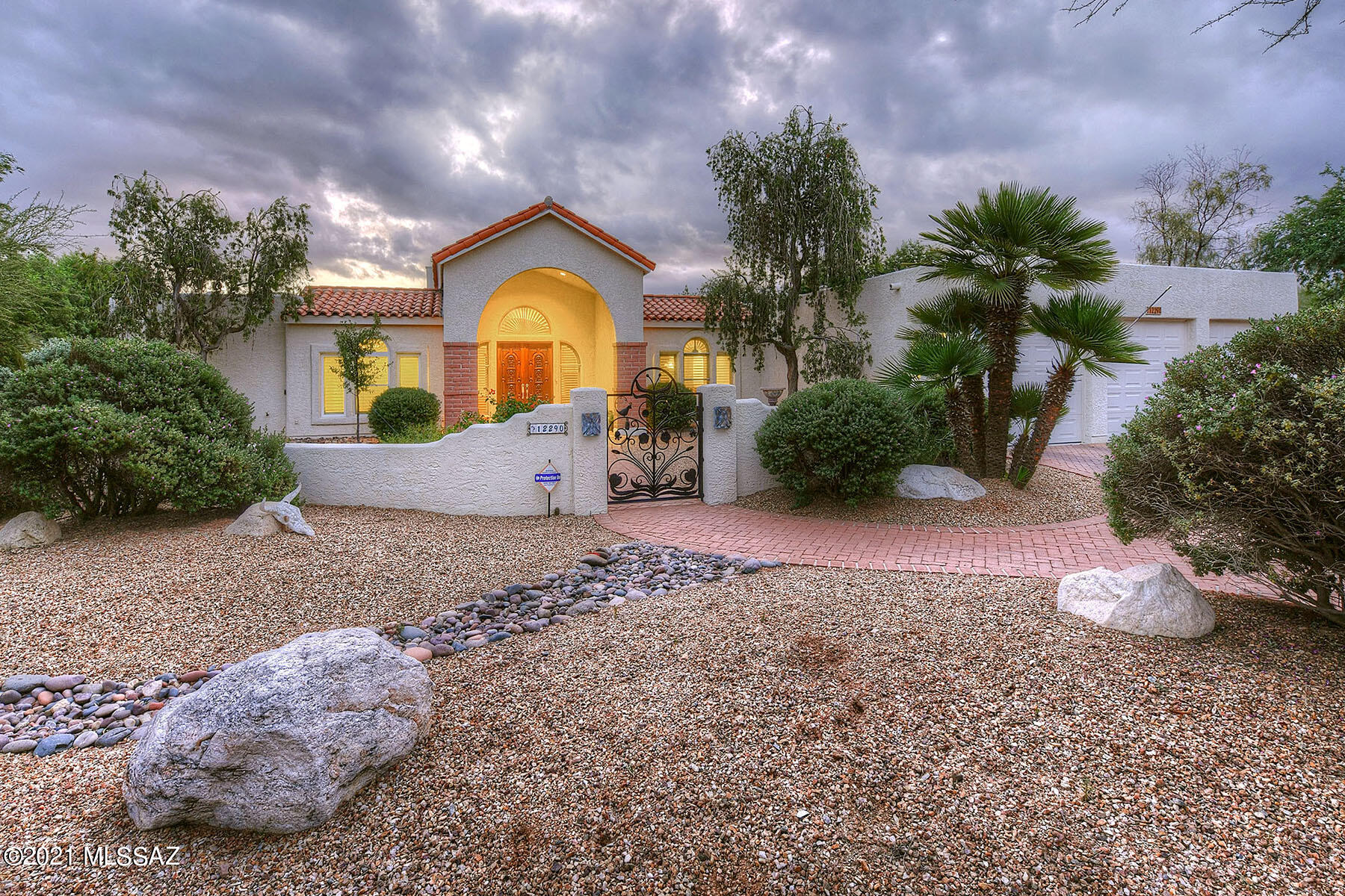 Stunning Mediterranean w/amazing views & privacy on 1 acre in small 12 home gated NE community. Beautiful Courtyard w/fountain, Grand entry w/soaring cathedral ceilings, arched windows & plantation shutters. Owners did lots of recent updates - tile throughout, huge entertaining island kitchen w/quartz counters, new appliances & opens to family room w/beehive fireplace. Split bedroom plan - master suite & bedroom/nursery/full bath on one side & guest bedroom/bath & a HUGE HOME OFFICE w/private patio on other side. Wide hallways, Incredible laundry room. Backyard has pool/spa/waterfall & protect-a child fencing, huge turf area, all new irrigation & pool equipment. 3-car garage & storage. Walking distance to Tanque Verde Elem & Hermosa Montessori School. A Diamond in the Desert! Move in Ready