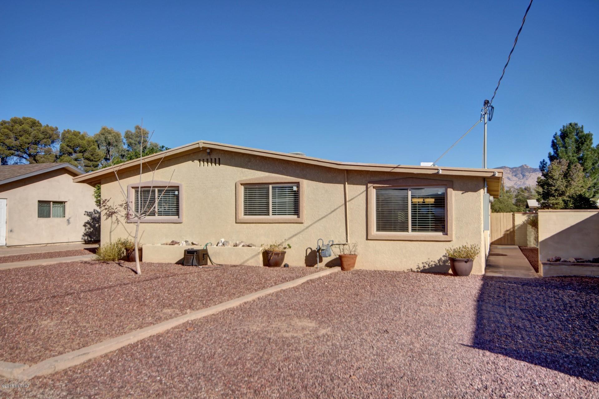 Fall in with this completely renovated midtown 4 bedroom ranch on a large lot with fenced pool! completely remodeled with travertine stone and bamboo flooring, spacious galley kitchen with stainless appliances and gorgeous granite counter tops.  Formal Dining and breakfast Hook connect with lots of natural light in the kitchen and living areas.  Huge back yard with mature citrus trees. Cover patio, fire pit and workshop. Other updates include 200 amp electrical panel, newer water main sewer connection, freshly coated roof.  No HOA. MUST SEE!