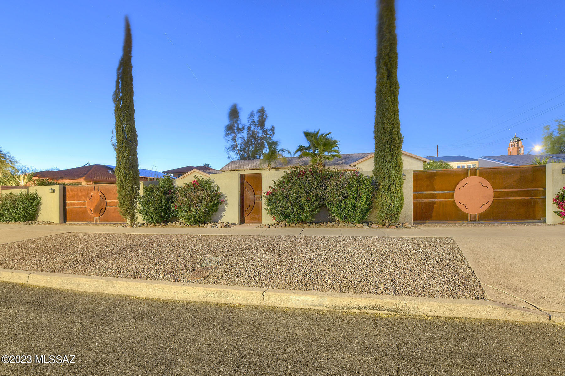Great opportunity in Sam Hughes. This private compound offers a spacious main home, with travertine and original white oak floors, 3 bedrooms, 5 bathrooms, den, formal living room with a wood burning fireplace, library, and formal dining room. The well-appointed cooks kitchen features cherry cabinetry, granite countertops, and stainless steel appliances, making it a perfect place for any aspiring cook. The primary bedroom boasts an ensuite bathroom, walk-in closet, and French doors that lead out to the backyard. The backyard itself is a private oasis with a pool, spa, and a separate, ull guest house complete with a great rm floor plan and separate bedroom and bathroom. In addition to the main house and guest house, the property also includes a separate office space located above the large 2-car garage, providing additional workspace and privacy. This Sam Hughes compound offers a luxurious and comfortable living space with plenty of amenities, all while being conveniently located close to the university and other desirable areas in Tucson.