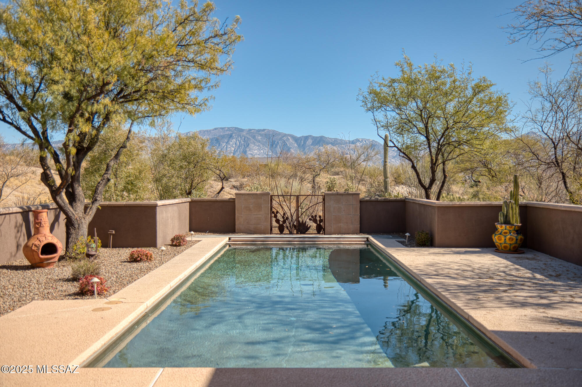 Estate sale offers fabulous opportunity to acquire and update 3,712 SF home designed by Tucson's renowned architect Ron Robinette and quality-built by Marc Allan Construction in guard-gated Stone Canyon! Great room design with excellent layout just needs updating to make this your own special place. Sold AS IS, this lovely great room style home includes 4 bedrooms, 4 baths, Den/Office, 3 Fpls, pool, large 3-car garage PLUS east-facing Catalina Mtn views AND lots of privacy! Enclosed courtyard leads to open design that can be styled contemporary or traditional. Spatially desirable home includes chef's kitchen (Sub-Zero & Viking), charming nook with Fpl, generous primary & split layout. You'll love the potential of the gigantic pantry & huge laundry. Great home ready to be made even better!