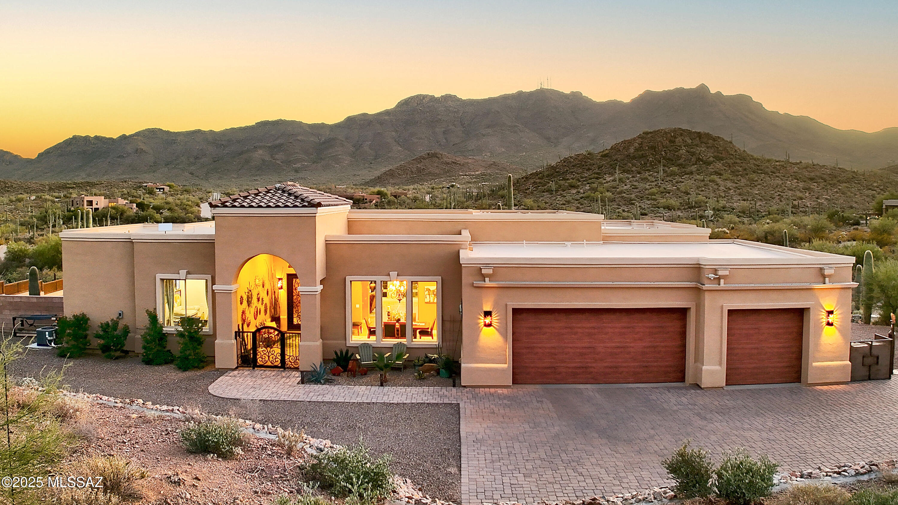 Seller will accept or counter offers between $999,000 and $1,075,000. This Gorgeous Contemporary Mediterranean Masterpiece with Spectacular Mountain Views and impeccable attention to detail, is an absolute bargain at this price range. Just 20 minutes from Downtown Tucson, this exquisite custom home features sky high ceilings, sweeping mountain views through a wall of windows, a gourmet kitchen with huge island, spa-like primary suite, formal dining room, and oversize extended garage. Take in both mountain and city light views from the spacious covered patio along with an abundance of wildlife. All this and more on 3.36 acres in a private gated enclave literally hiking distance from Saguaro National Park West and all with NO HOA. Modern luxury meets desert serenity...priced to sell!