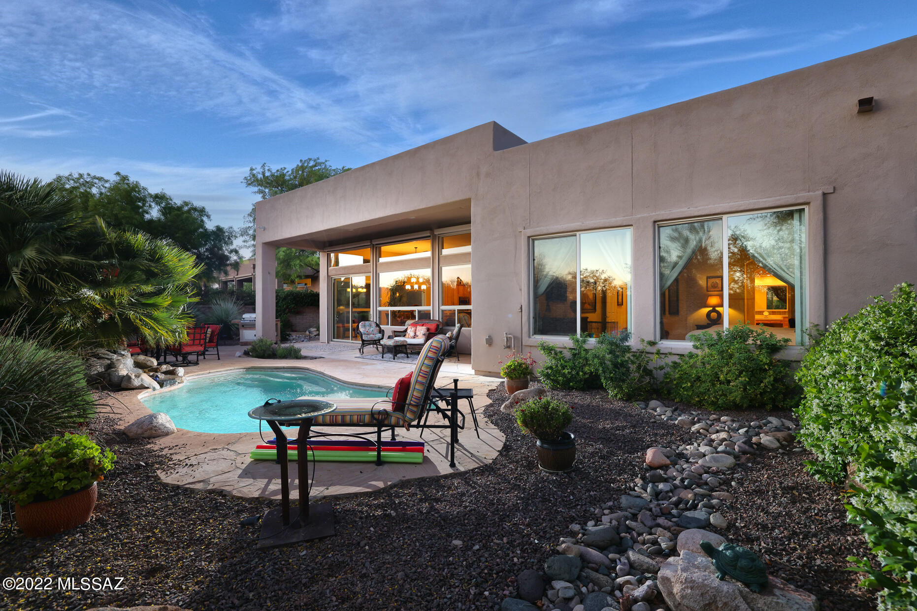 Gorgeous Fairfield home backs up to 200 acre natural desert preserve with stunning Tortolita Mountain and sunset views. Light and bright with wall of windows. This great room style 2BD, 3BA + Den residence in one of Rancho Vistoso's most desirable gated communities. Wonderful chef's kitchen w/granite, large wrap around sit up bar, SS appliances & gas cooktop. Electronic sunscreens on  back windows! Spacious primary suite w/door to back patio. Secondary suite is perfect and private for guests. Powder Rm, Den w/built-ins.  Enjoy the resort style back yard while relaxing on the back patio w/BBQ, pool  & rock waterfall & Fire-pit seating perfect for entertaining.This is one of the largest lots in the subdivision. Community rec area w/heated pool/spa. This is one of a kind!