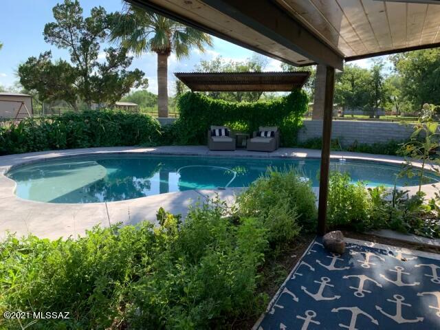 Unobstructed Mountain Views. 1,200 square foot garage built in 2017 with Martin Designer doors, multiple 220 service points and all the upgrades. House is on owned solar with legacy rates. Private Well was completely upgraded in 2018 with exempt water rights. All pastures are irrigated with 2019 irrigation guns. Mature gardens and a lot of trees- pine, ash and mesquite. Pool and pool equipment redone in 2019. AC was new in 2018. Multiple outbuildings for livestock and extensive steel fencing/gates allow for pasture rotation and perimeter is thoroughly secured. Gated property with direct access to the wash for trail riding, etc.
