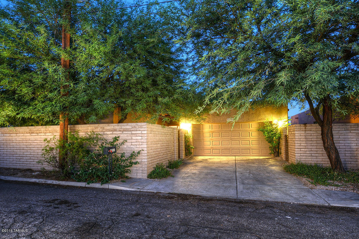 Newer construction, 1650 sq foot home in great central location! TEP Guaranteed for higher efficiency. Great room floor plan w/high ceilings, ceiling fans, niches, colored & scored concrete floors, concrete counters, Travertine & Cantera stone custom tile work on back splash, shower surrounds thru-out, beautiful maple cabinets, split bedrooms,  Large laundry room with sink, pre-wired for surround sound. 3 bedrooms 2 bathrooms plus a separate den/office! Master bedroom has private bathroom & walk in storage! Great entry courtyard! Separate covered patio Plus a 2 car garage! Freshly painted throughout!