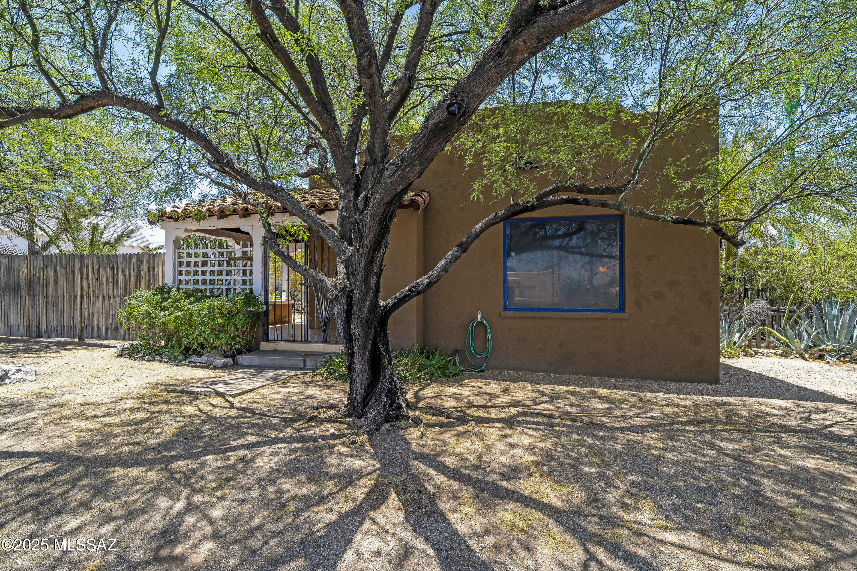 4% interest rate Seller carry-back available! Brand-new HVAC with a 10-year warranty and a freshly resurfaced flat roof make this historic 1936 Pueblo-style home a true standout in Jefferson Park. Full of restored character— ¾'' oak hardwood floors, coved ceilings, mahogany doors, wood-framed windows, and original fixtures—this home blends timeless charm with modern reliability. The solid brick garage (approx. 348 sqft) with 220v power is perfect for a studio, workshop, or future ADU. Sitting on a spacious corner lot with alley access, parking, and garden space, there's room to expand and create your vision. Eligible for historic designation with potential tax savings (buyer to verify). Unbeatable location on the Mountain Ave bike pathminutes to U of A, Downtown, Banner, 4th Ave, and transit.