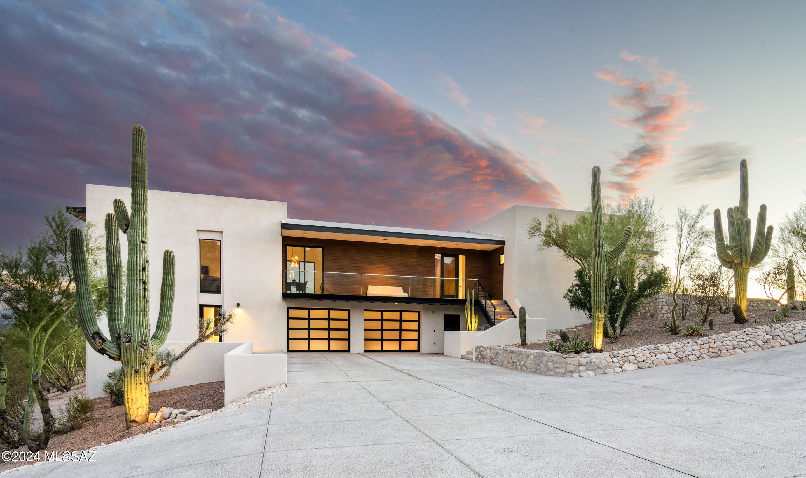 Experience Unmatched Luxury in the Catalina Foothills 

Nestled on 2.69 private hillside Catalina Mountains acres, this masterpiece offers sweeping views of city lights below. Revitalized by award-winning architect Jim McPeak, House Concepts LLC, & Gideon Architects, home exudes modern sophistication while preserving its mid-century roots. 

Open-concept great room features a sleek modern fireplace. Chef's kitchen is a showpiece, with Miele appliances, sleek Sie Matic German cabinetry & gorgeous Dekton countertops. Solid surface plank flooring flows throughout, uniting each luxurious space.