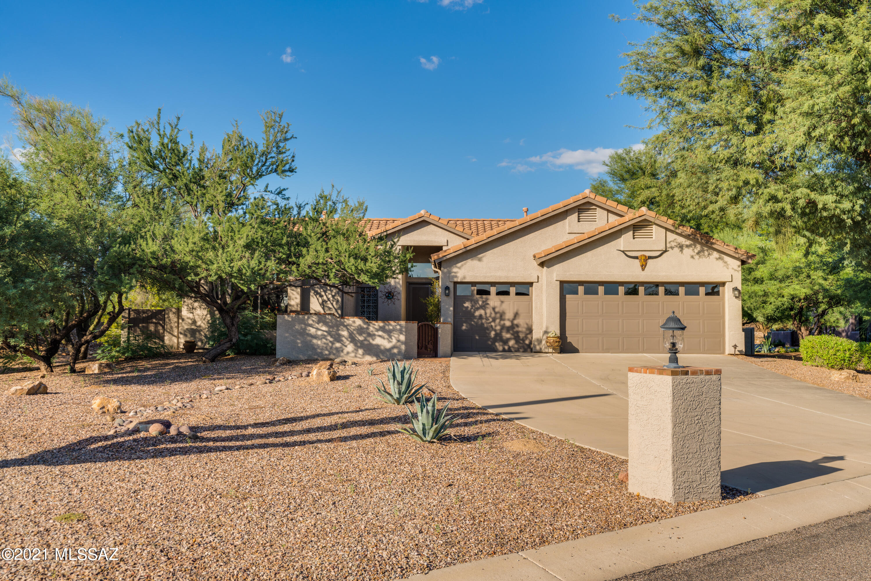 Priced to Sell! Golden Opportunity to own in prestigious 3RD Fairway in Oro Valley County Club! Lightly lived in home with Open spaces, Split Floor Plan, 3 Bedrooms PLUS Den. Gated Courtyard leads to 9' custom front door. Cook's Kitchen has gas stove, Granite Counters, Walk-in Pantry, Cabinets galore, Workdesk & Lg Center Island. Flows easily to the casual eating area & comfortable Family Room w/Gas Fireplace. High ceilings & large windows. Spacious Master Suite has Bay Window, Door to Patio, bath w/roomy walk-in closet. Wall of Windows in the Great Room to capture the outdoors - Flagstone Patio, Pool w/Waterfall & easy-care Landscape.  Several patio areas, Views of the gorgeous Catalinas. Oversized 3-car Garage w/Epoxy floor & cabinets. Enjoy the OVCC lifestyle today! Furniture available.