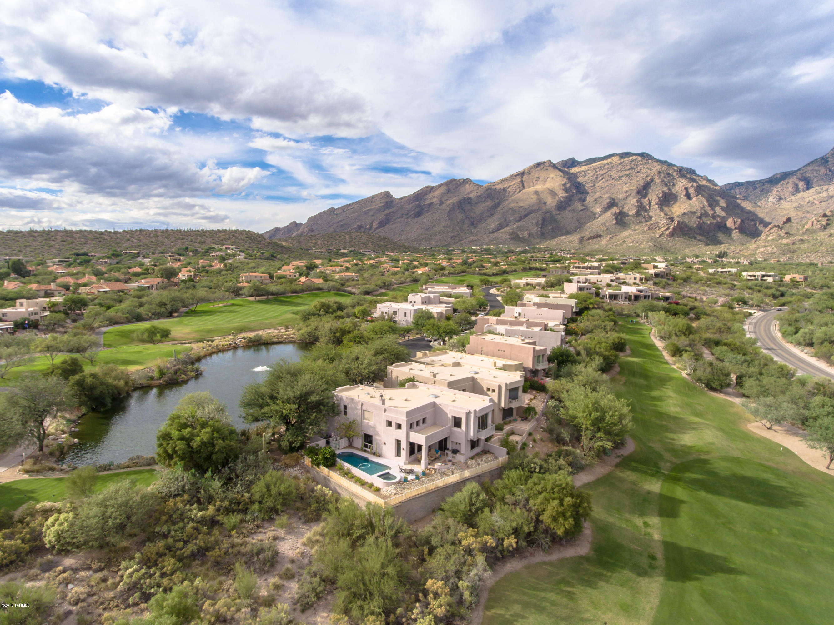 Spectacular, Ridge Top Home in Ventana Canyon w/ Commanding City, Mountain, & Golf Course Views!!  Charming Courtyard Entrance Leads to a 3BR/3BA Masonry Constructed Home & Separate 1 BR/1BA Guest Casita.  Fine Features Include:  Sold Wood Doors Throughout, Great Room w/ Vaulted Ceilings, Separate Den/Office, Stacked Stone Fireplace, Custom Built-Ins, New Carpet, and Large Island Kitchen w/ Granite and Stainless Appliances. 
Private Outdoor Living Area Includes Sparkling Pool & Spa, Covered Patio w/ Automatic Shade Screen, Fire Pit, & Stainless Grill. 2 Car Garage w/ Epoxy Floors, Storage Cabinets, & Work Sink. Located on a Quiet Cul-de-Sac Adjacent to Golf Course Lake & Waterfall.
** In MLS go to Photos> Virtual Tour for 3D Floor Plan **