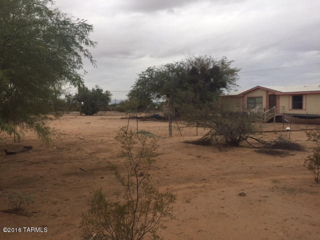 Corner Lot on Sandario and Ina.  This Home has SW Gas, cable, very solid wheel chair ramp and front patio, nice views.  Needs cleaning and has some fire damage. Might be a perfect buy for a fire restoration company, handyman or flipper.  Use extreme caution when entering property.  Bring all offers.