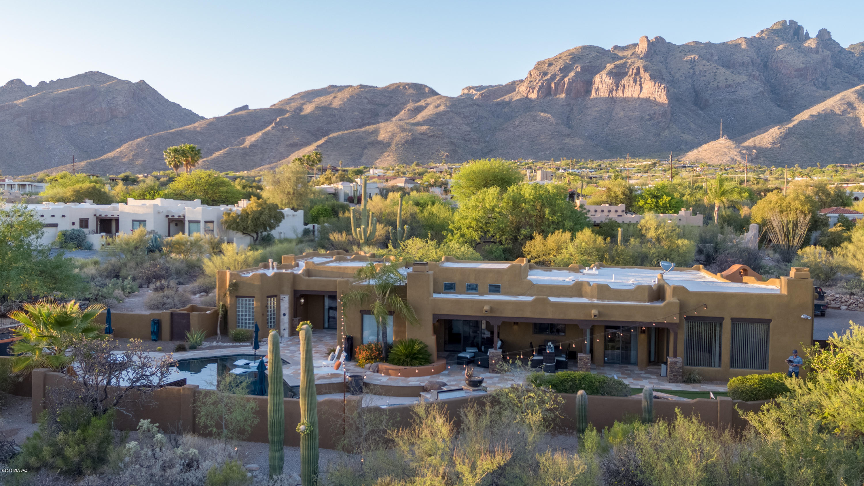 Beautiful 3200 ft custom built home in the foothills with amazing city and mountain views. Next to upscale shopping, great restaurants #1 ranked elementary school in Catalina Foothills district. Home features 4 bedrooms with an extra study and built in cabinetry, computer desk and fireplace. Large master suite with dressing area, 2 walk-in closets, walk in shower and jet tub. New vertical blinds, roman shades, stainless steel appliances, paint, and carpet throughout. The exterior has been completely remodeled with paver driveway, paint, rustic garage doors, stacked stone, Vista lighting, water features, travertine pavers, putting green, outdoor shower, pebble tec infinity edge pool, spa and lagoon. Sunken gourmet outdoor kitchen with Lynx 54'' grill, keg-r-ator and granite tops. Much more