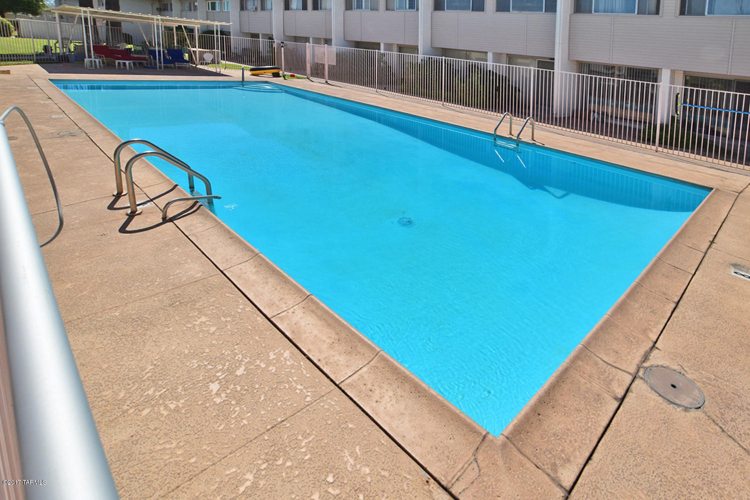 Rare Ground Floor Unit with enclosed patio for home office or library. Maintenance Free living HOA takes care of Water ,Insurance and most repairs.Close to Reid Park,Golf Zoo Shopping and much more.