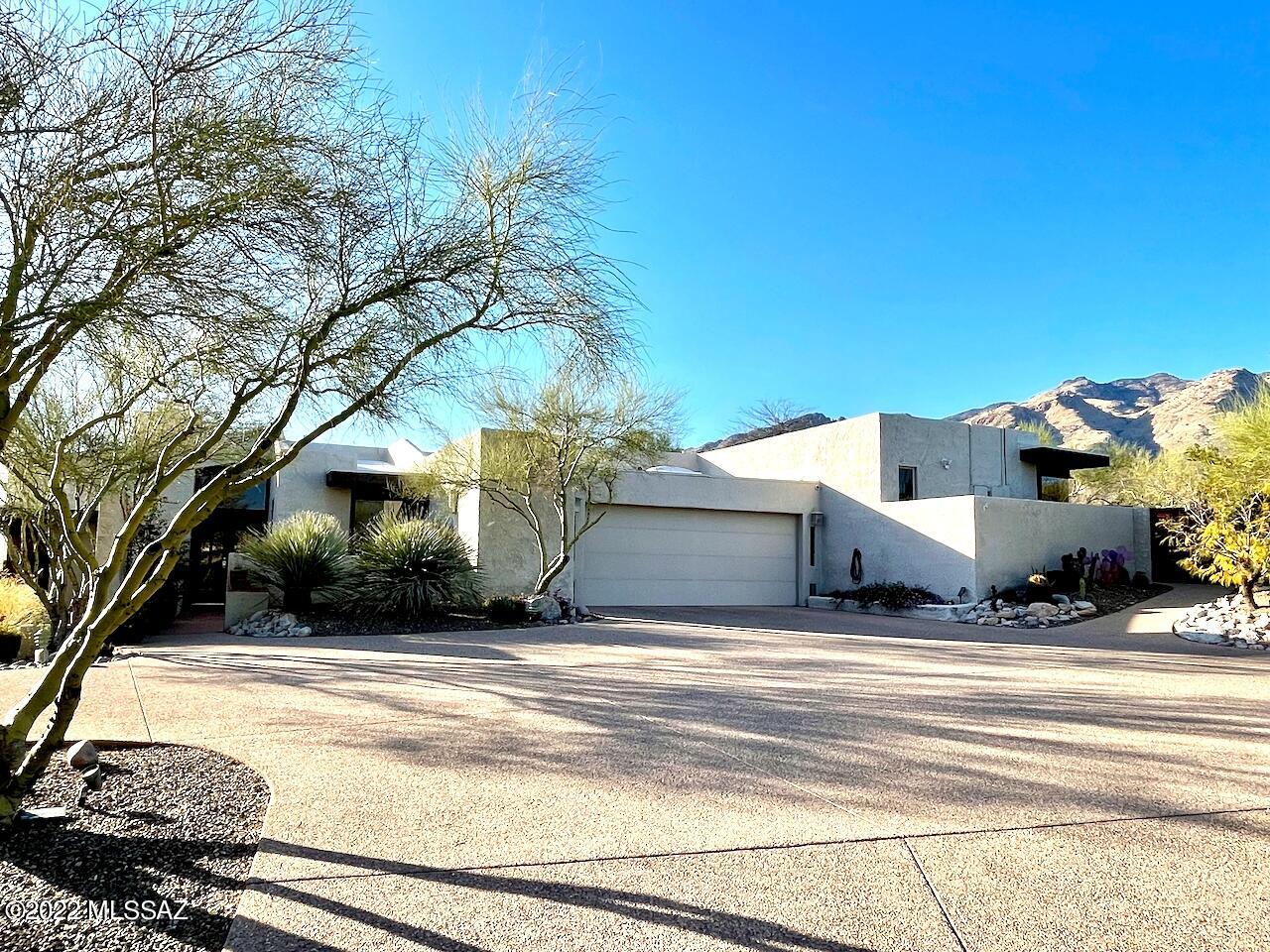 Spectacular high ridge lot with dramatic mountain, city, and sunset views. Custom built 4173 sq ft architecturally unique David Tyson home with batten and board high pine ceilings, walls of windows, and thoughtful design details throughout. Featured in House Beautiful. Resort-like yard with multiple patios, pool, and beautiful desert landscaping on just under an acre. Five bedrooms, including two guest suites, all with views and walk-in closets. Primary bedroom includes fireplace, sitting area, large tub, and private patio with hot tub. 4 1/2 baths. New designer gourmet kitchen with Sub-Zero fridge and Thermador Freedom top-of-the-line induction cooktop, new anti-microbial washer and dryer. Project room/office with spectacular mountain views. 713 sq ft garage with two large storage closets Spectacular high ridge lot with dramatic mountain, city, and sunset views. Custom built 4173 sq ft architecturally unique David Tyson home with batten and board high pine ceilings, walls of windows, and thoughtful design details throughout. Featured in House Beautiful. Resort-like yard with multiple patios, pool, and beautiful desert landscaping on just under an acre. Five bedrooms, including two guest suites, all with views and walk-in closets. Primary bedroom includes fireplace, sitting area, large tub, and private patio with hot tub. 4 1/2 baths. New designer gourmet kitchen with Sub-Zero fridge and Thermador Freedom top-of-the-line induction cooktop, new anti-microbial washer and dryer. Project room/office with spectacular mountain views. 713 sq ft garage with two large storage closets. Located in the Skyline Bel Air neighborhood, includes access to community Ramada, pool, and tennis and basketball courts. In Catalina Foothills School District CFSD 16, excellent location near Safeway, La Encantada mall, and many excellent restaurants. Pool service/cleaning and landscaping included in rent.