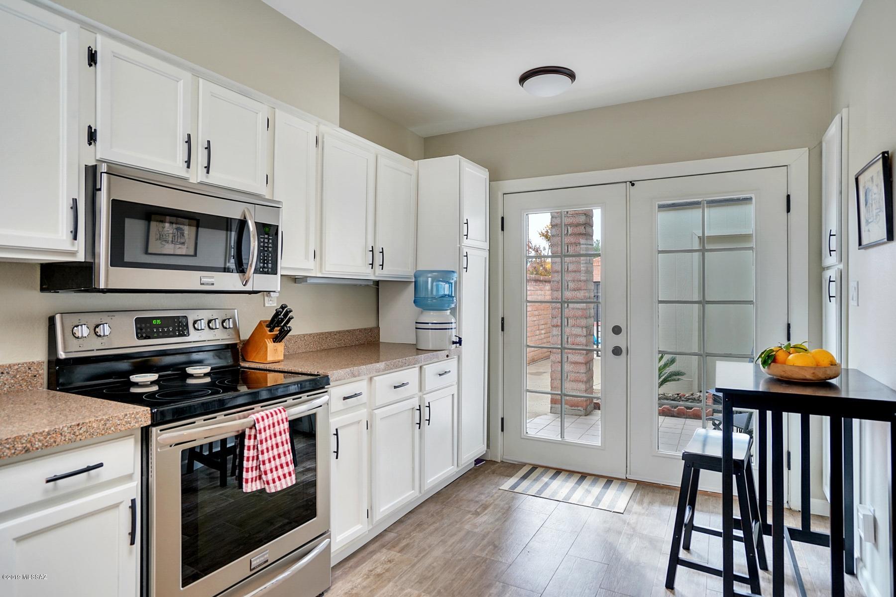 Beautifully remodeled townhouse in Tanque Verde Estates. Mountain views of the Catalinas from the covered patio. Two bedrooms and two fully renovated baths. Renovated kitchen with new stainless appliances. Two car garage. Community pool and rec center. All you have to do is move right in!