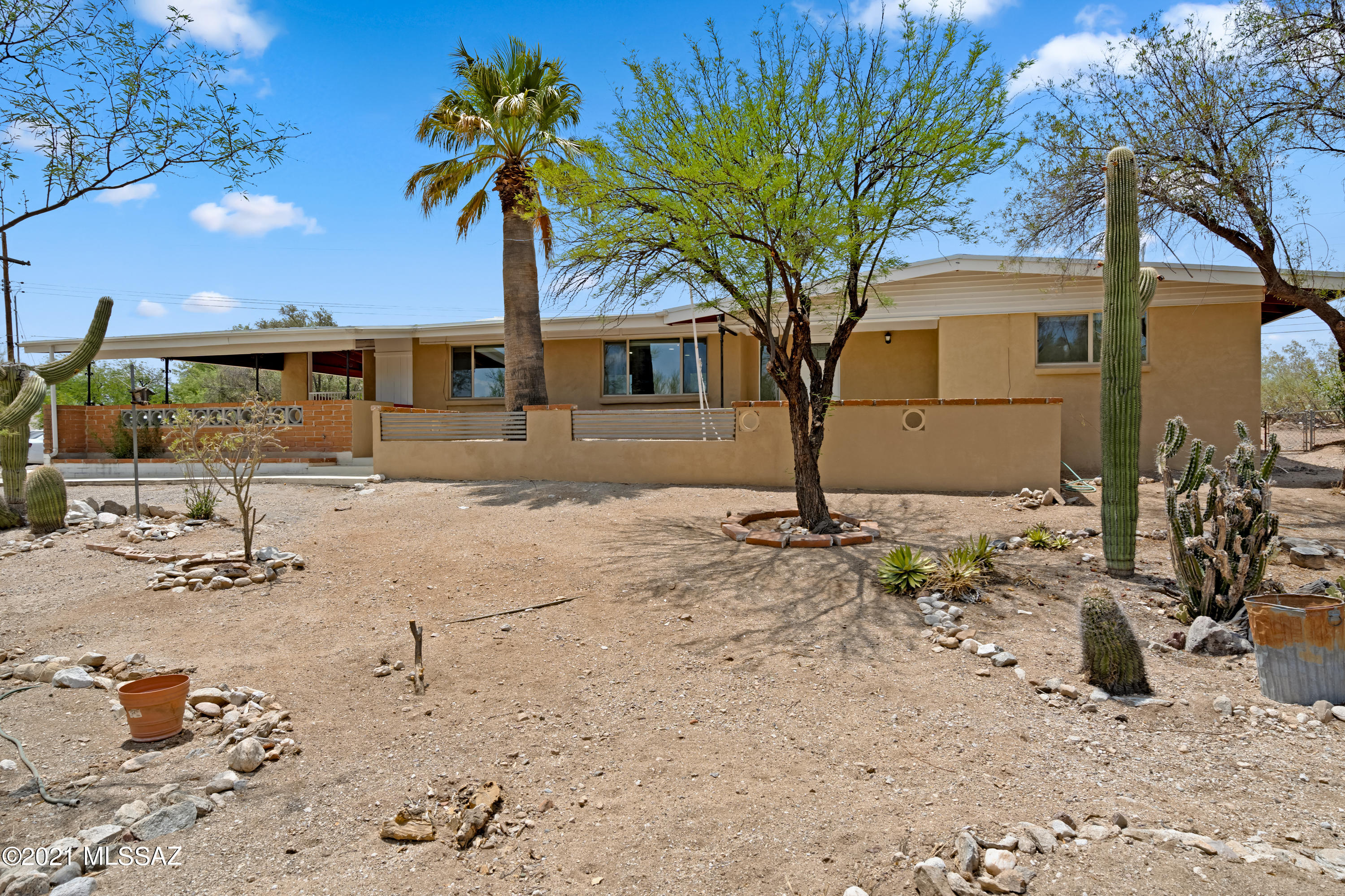 Enjoy mountain views from this ranch style home with a huge kitchen island, all new appliances, stunning tile, newly remodeled bathrooms and light fixtures and ceiling fans throughout. This home has space on the North side to expand one day if desired!
