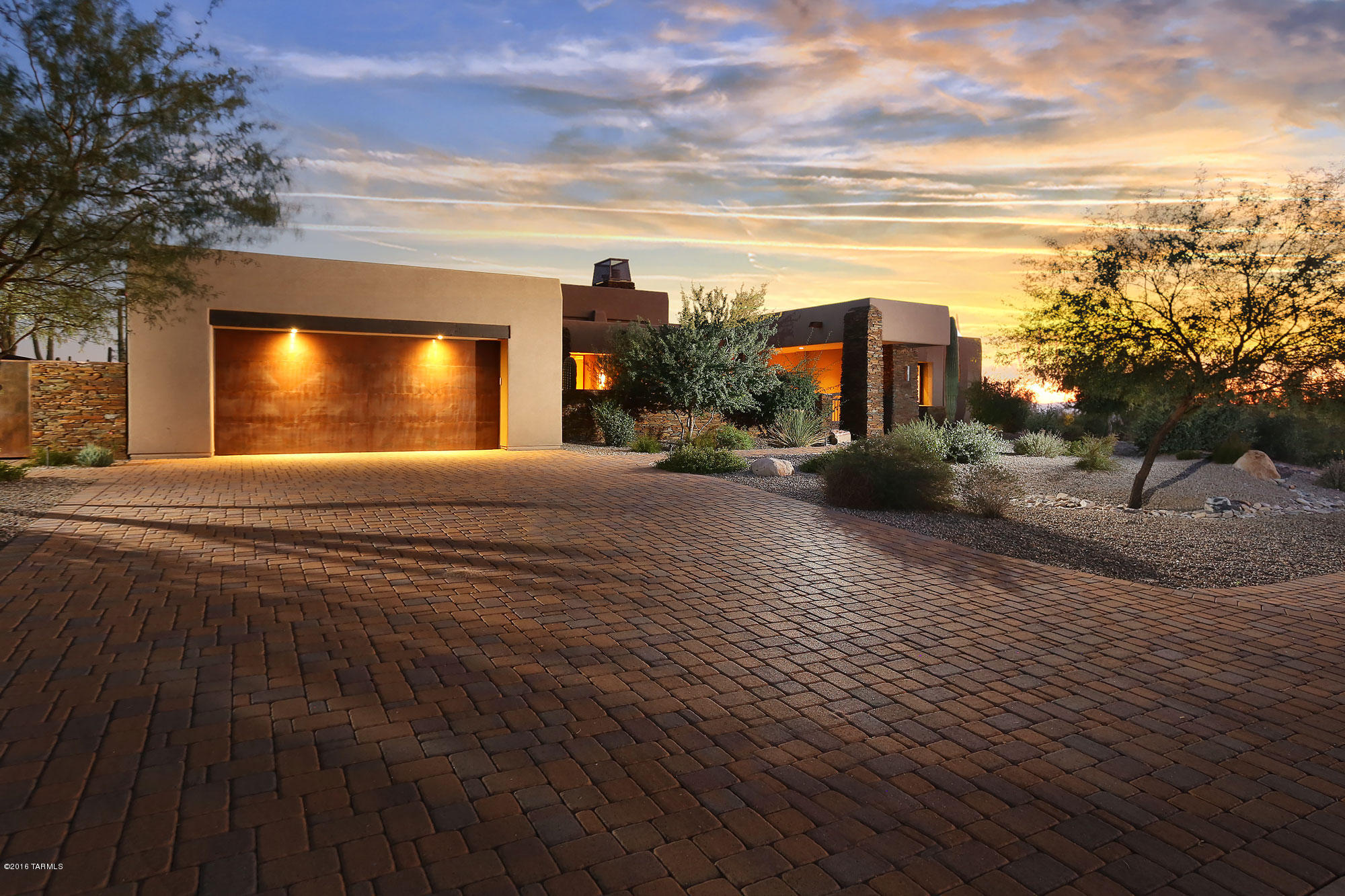 Stunning Custom Home located within the exclusive Residences at The Ritz-Carlton, Dove Mountain. Beautifully designed home featuring motorized disappearing wall, Wolf & Subzero Appliances and upgraded window treatments. Backyard is Entertainer's Dream! Award Winning Infinity Pool & Spa- located on a private corner lot with absolutely endless views. Access to Ritz-Carlton Resort, Pools, Fitness Center, Concierge Services, Social Events and Golf Club are included. Truly amazing!