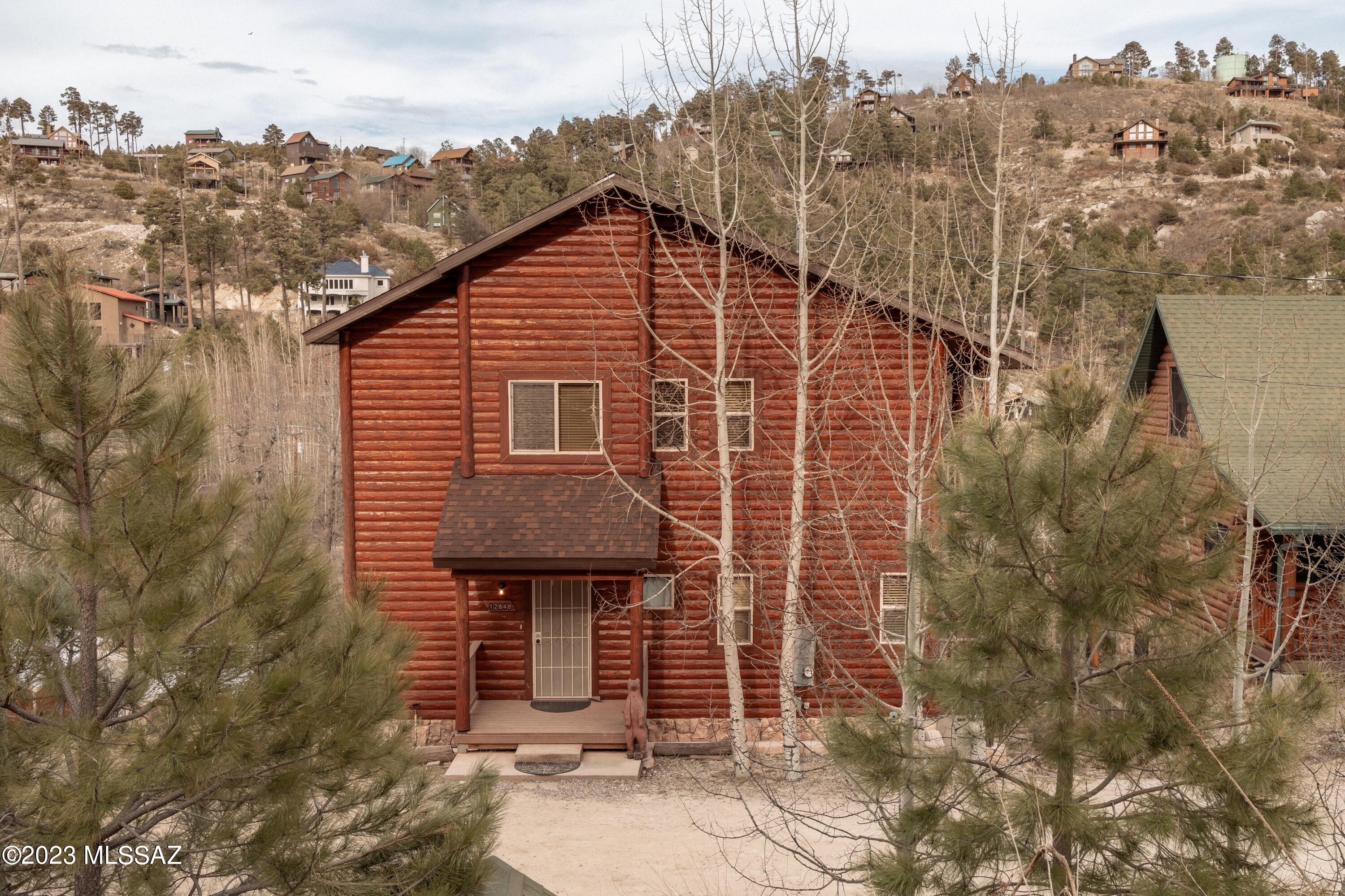 RANGE PRICE: $799,999-$825,000
Beautiful Tri-Level Cabin nestled in the heart of Summerhaven! Very accessible paved road with ample parking and walking distance to the Summerhaven Village. Large cabin for lots of mountain fun with friends and/or family! 3 covered outside deck spaces to enjoy the mountain air and beautiful views! This large cabin has lots of space for large groups or families.