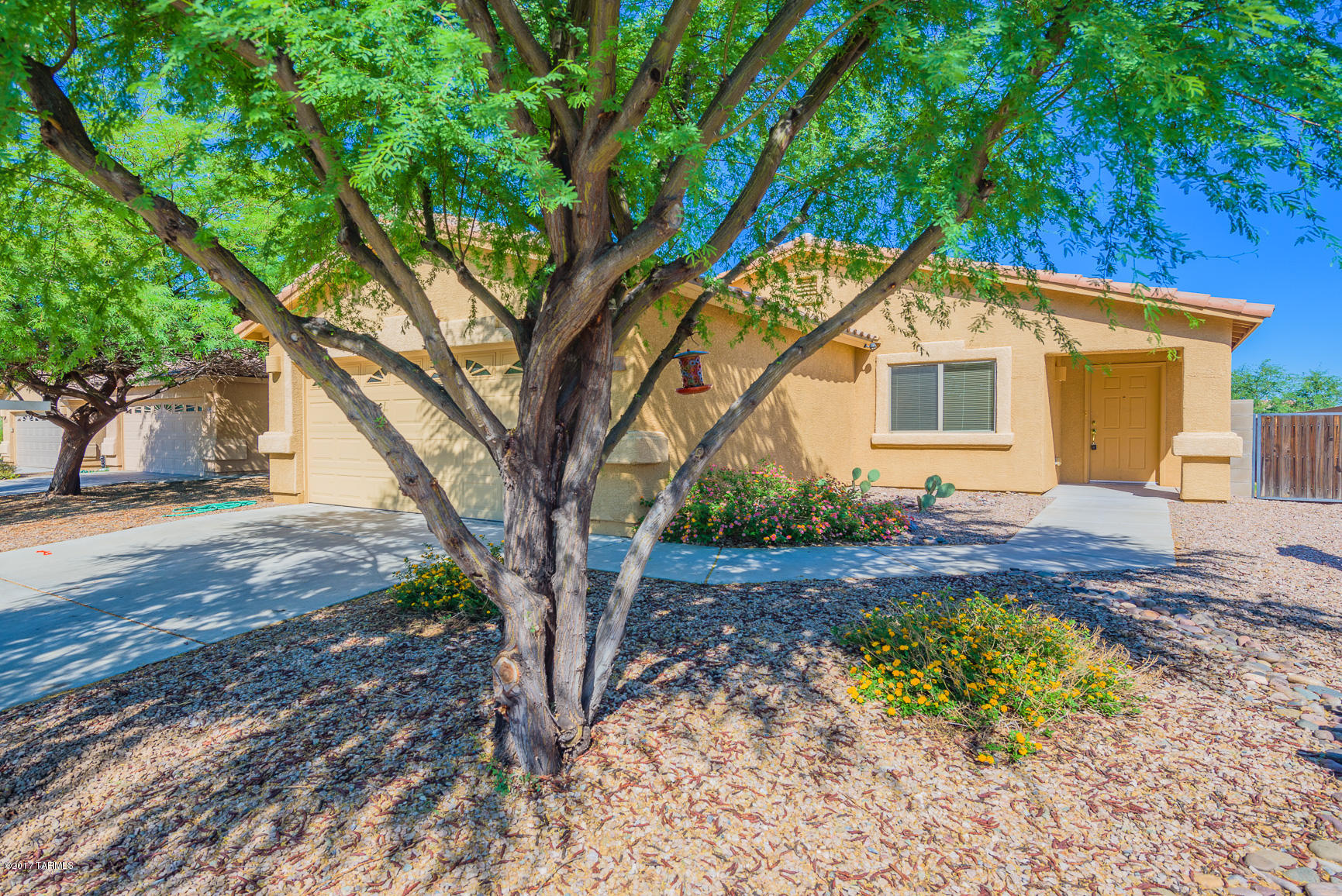 What a fantastic gated community in the Vail School District with easy access to I-10! Enjoy the community pool & spa, playground, basketball & volleyball, and fitness area. Located on a larger lot with no adjacent rear neighbors, this house is ready for you to make it a home. The backyard features full length covered patio. New carpet has just been installed in the bedrooms, the rest of the floors are tile and laminate for easy maintenance. The master bathroom has dual marble sinks in an executive height vanity and a garden tub/shower combo. This efficient floorplan has a great room with archway window from the kitchen overlooking the family room. Come see this cute house before it’s too late!