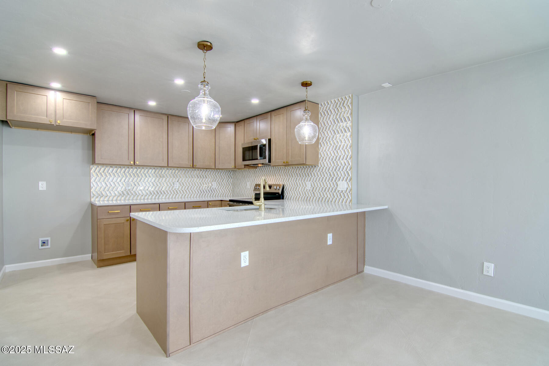 Absolutely awesome remodeled home in a great central subdivision. You will love this gourmet kitchen with quartz counter tops and pendant lights. Elegance meets comfort in this fantastic home. Spacious finished garage and a workshop space. Spa like bathrooms and all new flooring throughout. Close to shopping schools and nice restaurants. Easy commute to downtown and U of A. Seller is a licensed real estate agent in Arizona.