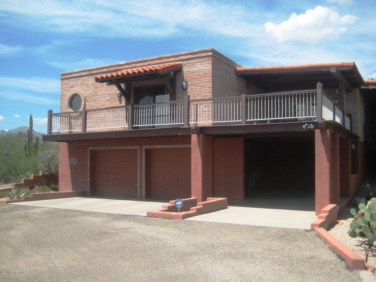 Enjoy nature & privacy in this beautiful 3bdr/3ba home! You will love the outdoor living from the four patios all w/stunning mountain views! Spacious master w/three closets, master bath has oversized sunken tub. Downstairs guest suite has private bath and entrance. Bright/open family room, Formal LR/DR has warming brick fireplace, custom kitchen w/tile counters and much more! Two car garage and single car carport.