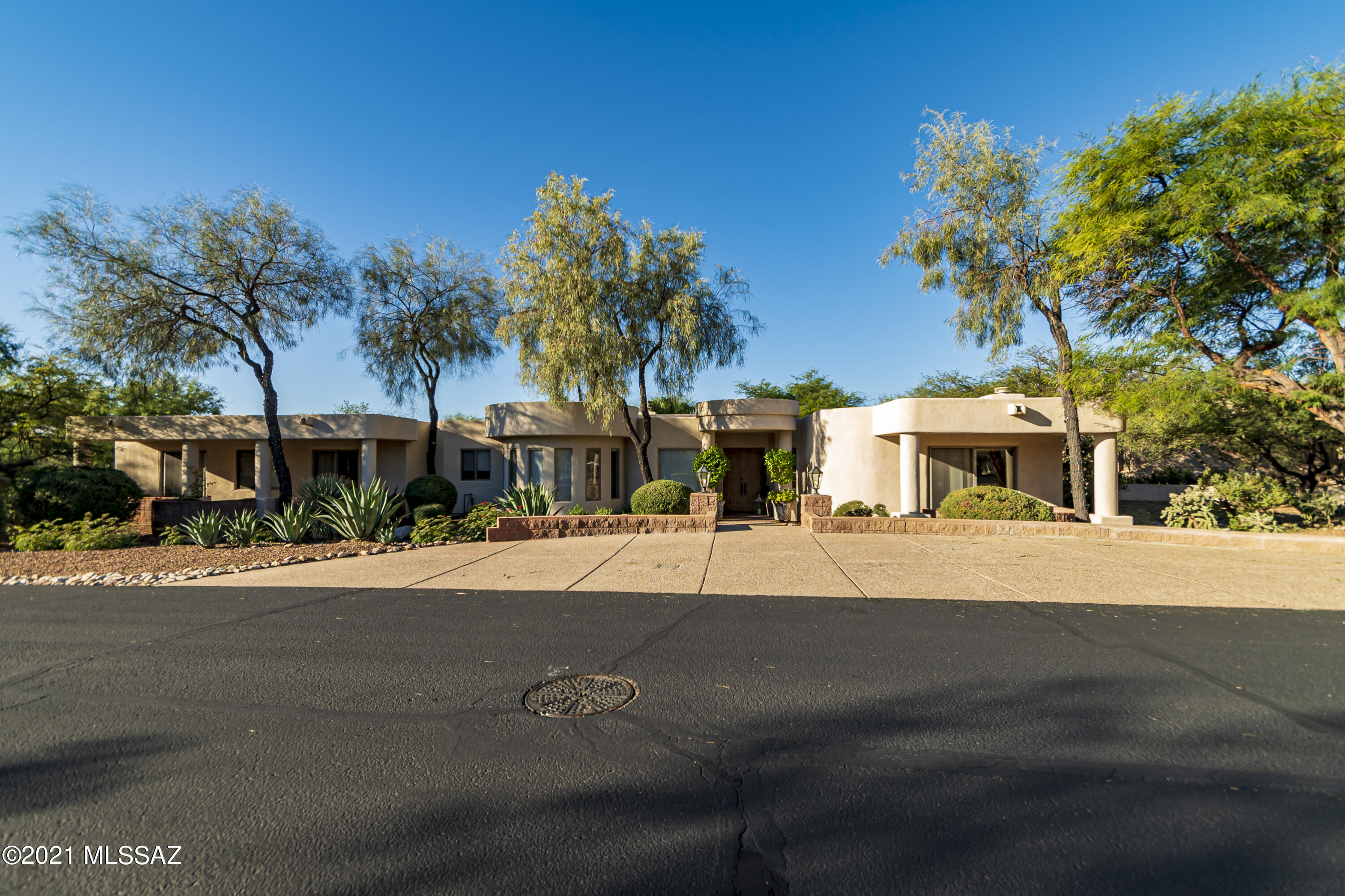 Tremendous Mediterranean home on a corner lot. 5-bedroom 3 full baths, 3365 Sq. Ft. In this prestigious gated community of La Paloma. This custom home Italianate design has much to offer, 5 covered patios for every bedroom, Gourmet kitchen with honey maple cabinets, exquisite LR with high wood ceilings, dramatic 2 way marble fireplace, wall of windows, formal dining room cozy family room, lovely breakfast nook, sensational master suite w/fireplace, sitting area, jacuzzi tub with fabulous views of finger rook from jacuzzi tub and master suite with private patio, guest suite with private bath and outside entry to pool and spa, built in cabinets in all bedroom closets and just think a 3 car garage with cabinets. So much to admire. Call today to view this magnificent home.