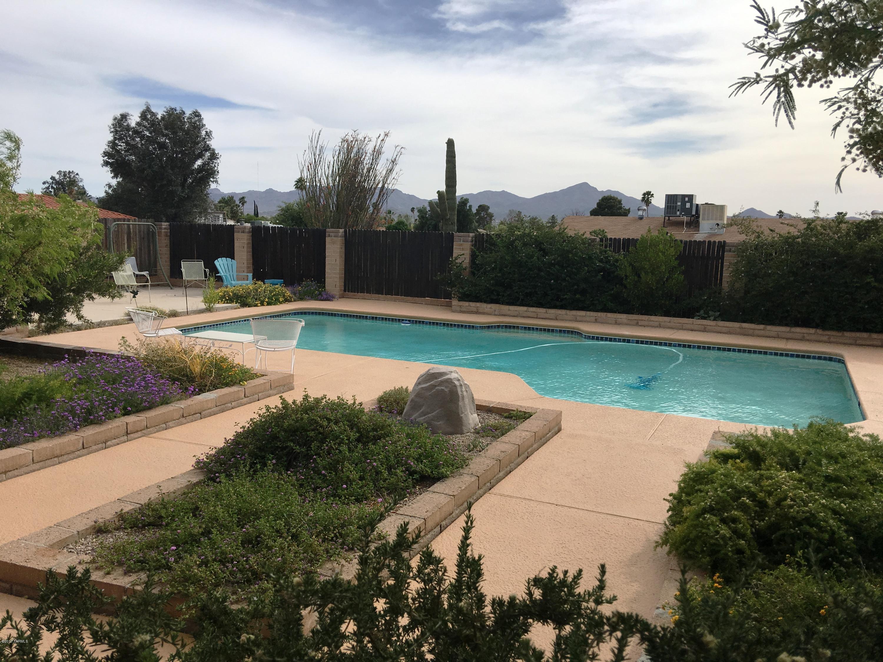 Wonderful Orangewood Estate home on nearly 1/4 acre Incredible backyard with mountain & sunset views, large pool, lush landscaping and lots of patio space for entertaining!  Double gate, RV cleanout & RV space.  Ceramic tile and wood floors, fresh paint thru-out, ceiling fans in all BR, roof re-coated, dual cooling, large family room with fireplace.