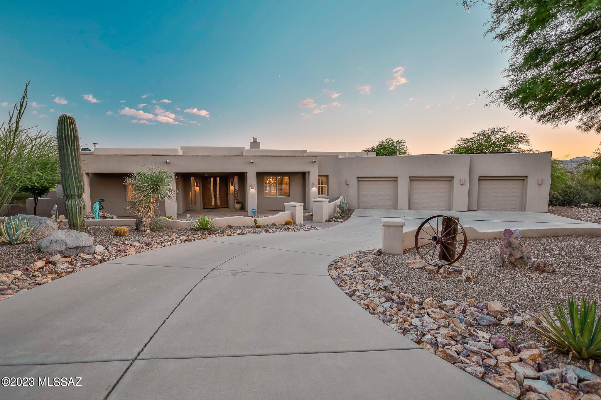 Live the epitome of the Arizona lifestyle in this stunning custom built, 3,698sqft Dorn home, sitting on 1 acre at the base of the Santa Rita Mountains in Madera Reserve II. As you enter the home, your eyes are immediately drawn to the floor to ceiling windows, zero edge heated pool, and unobstructed mountain views. Enjoy the spacious living rooms w/double sided gas fireplace, wet bar, and sight lines to the formal dining - perfect for entertaining! The stylish kitchen features gas cooktop, granite countertops, sub-zero refrigerator, stainless appliances, an eat-in breakfast area, and an oversized butler pantry and laundry room fitted with a new energy efficient washer and dryer. 
The home's split floor plan offers two master suites with patio access, walk-in closets and walk-in tile showers. A spa tub completes the primary suite, while the other two bedrooms and bathroom also boast walk-in closets and tile walk-in showers. 
Outside you'll find an extended flagstone patio to relax and enjoy the zero edge pool and spa. Fruit producing trees, a raised bed garden, and awe-inspiring Arizona sunrises and sunsets are just a few additional attributes of the manicured outdoor space. 
This beautiful home also includes an oversized 3 car garage, with custom work benches, overhead storage, and exterior access. Occupied by the original owners for the past 24 years and meticulously maintained, recent updates include new interior paint, 2 HVAC and furnaces in 2021, a new roof in 2022, and Tesla solar for the home.