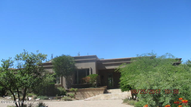 Terrific Foothills location! Exclusive gated neighborhood of custom homes. This home is stunning and highly upgraded. Media room on the lower level. The back yard is a private resort with pool, spa and waterfalls.