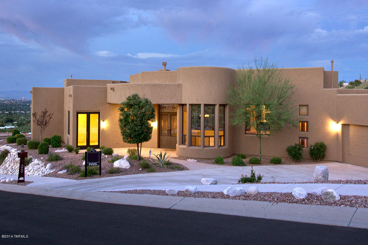 STUNNING CONTEMPORARY WITH DRAMATIC CITY & MOUNTAIN VIEWS IN PRESTIGIOUS GATED SABINO MOUNTAIN,ELEGANT IRON & GLASS ENTRY DOORS,EXQUISITE GREATROOM WITH HIGH CEILINGS,WALLS OF CURVED GLASS WINDOWS,STACKED STONE FIREPLACE,FORMAL DINING ROOM,GOURMET ISLAND KITCHEN WITH GRANITE COUNTERTOPS,GAS STOVE TOP,STAINLESS STEEL APPLIANCES,LOVELY BREAKFAST ROOM,TRAVERTINE FLOORS,3 BEDROOMS PLUS STUDY OR 4 BEDROOMS,4 BATHS,MASTER SUITE WITH LUXURIOUS BATH WITH GRANITE COUNTERTOPS,JACUZZI TUB,LARGE WALK-IN CLOSET,FABULOUS BACKYARD WITH POOL,WATERERFALL,BBQ,FIRE PIT, 3 CAR GARAGE. VIEWS! VIEWS!VIEWS!MOVE IN READY!-SEE FLOORPLAN UNDER VIRTUAL TOUR.FURNITURE INCLUDED WITH PURCHASE OF HOME.