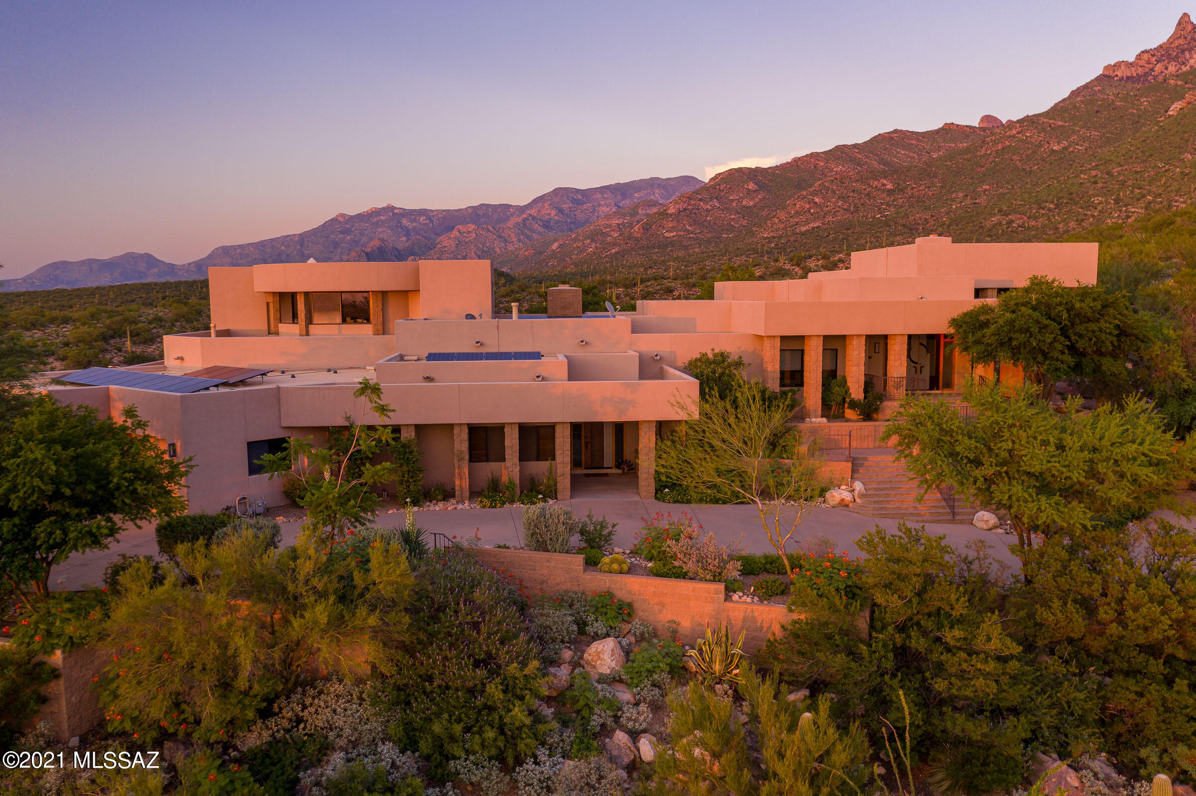 The Resort at La Reserve-this amazing one of a kind home beautifully designed  takes advantage of the amazing Catalina Mountain views from this secluded ridgetop location. The original owners truly made every dream come true-koi ponds, a round office of windows with 360 views an indoor stream with area for meditation or hobbies a fabulous garage workspace area. The master retreat designed by Rochelle Rubin provides the perfect setting for a peaceful bond with views and nature. Top quality products and selections through out. Ample room for entertaining on the numerous patios and decks each with stunning unique views and the split plan gives privacy to guests and family members. Minutes to shopping, amenities, the loop trail, Catalina State Park. Truly unmatched views!!