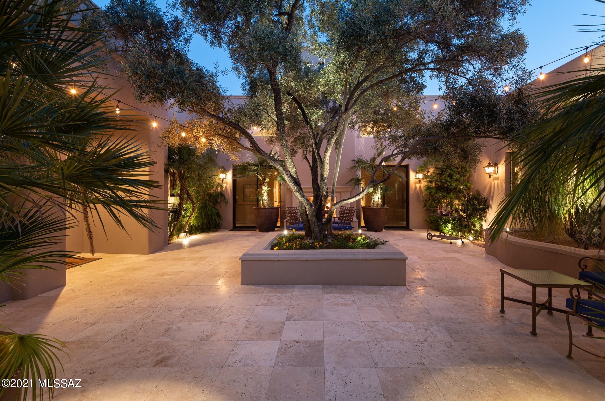 Ron Robinette, Tucson's Premier Architect, is selling his own home. Be the beneficiary of living in this stunning single owned custom home, w/ the finest, uniquely designed, upscale features by Tucson's acclaimed artisans. This Courtyard House is tucked w/i a quiet cul-de-sac in a gated community.  Stylistic w/ contemporary gallery-like rich/warm finishes, this solid integra block masonry home features: Newly remodeled chef's kit, split floor plan enclosed courtyard, raised ceilings w/ wood beams/tongue & groove, plaster interior walls, artistic custom display walls, modern light fixtures, air-scrubber house purifier, 3 car gar w/ wall sep 1 bay. Versatile indoor/outdoor prof designed living - fully renovated courtyard, ''A+'' cacti specimens. Adj to walking paths
