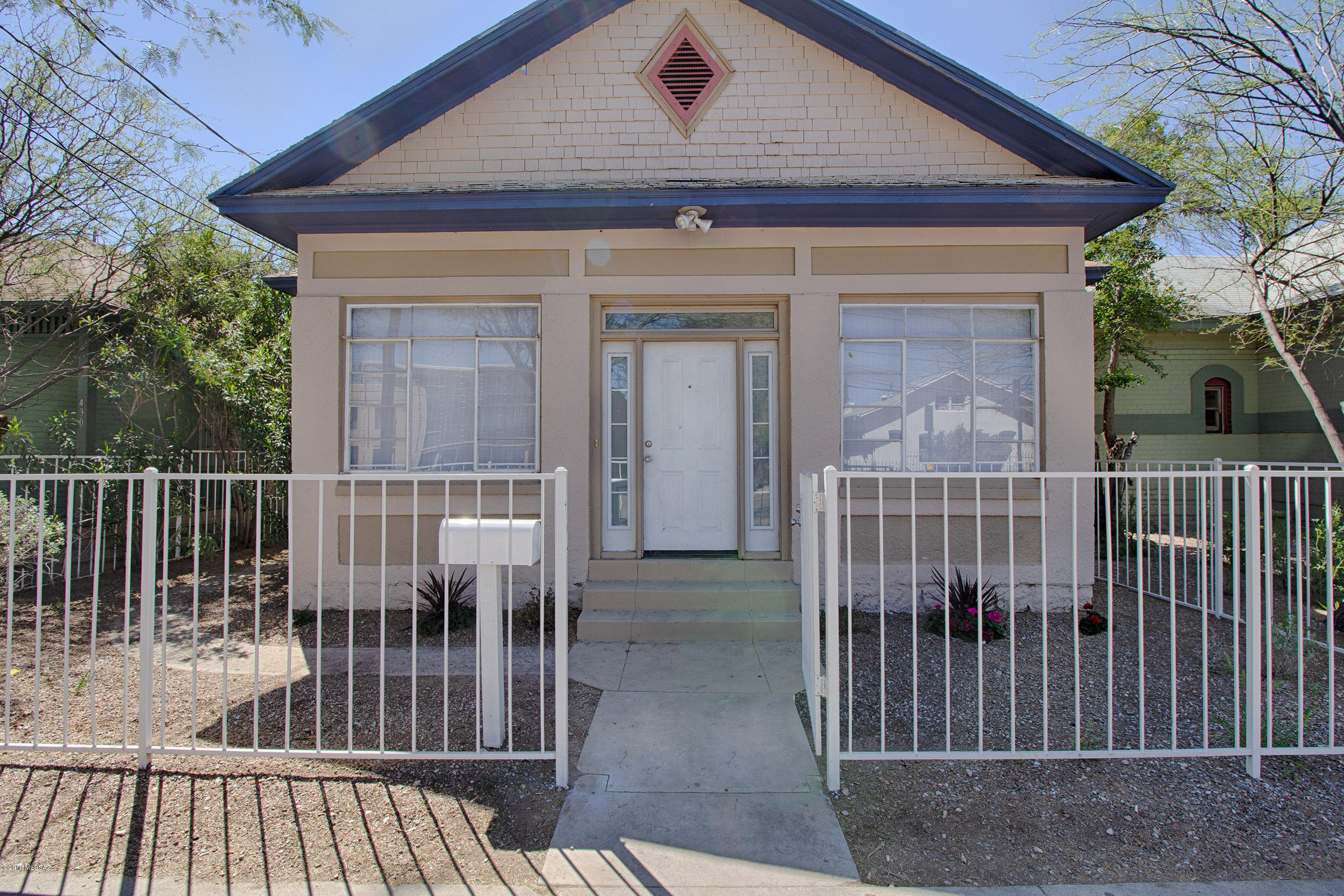 Own a piece of history with this ''charming'' Tucson bungalow built in 1907.  This property boasts 5 bedrooms with hard wood flooring/4 bath with newer tile.  Owner has recently upgraded kitchen with new cabinets, appliances, flooring, new AC , front porch enclosure & dual pane windows. It is C-3 zoned and can be used as residential/office/retail/workspace! Unlimited possibilities and right in the heart of downtown Tucson's famous 4th ave Iron Horse neighborhood. Minutes from the trolley, shopping, restaurants and less than 2 miles from the University of Arizona. MOTIVATED SELLER SO BRING ALL OFFERS!