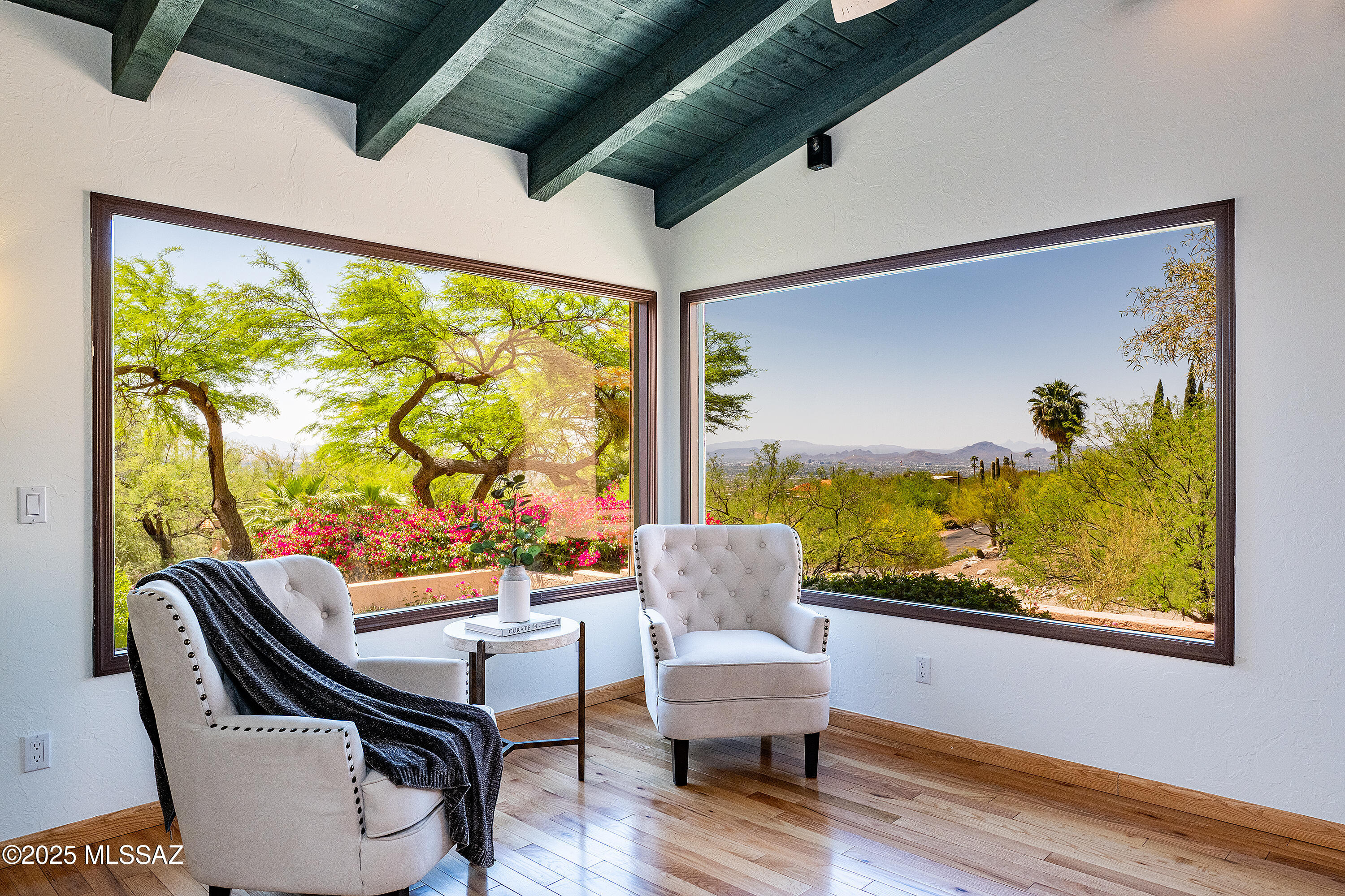 Outstanding Home offer sweeping sunset views. This gem in prestigious Skyline Country Club Estates boasts gracious wood work, beamed and wood planked ceilings, cherry cabinetry, hard wood floors and guest quarters on garden level.  Located on 1.25 acres this inviting home sits high up on the hill for expansive city views/dramatic mountain views in back. 2/3 bedrooms on main floor and second suite on garden level. Primary bedroom hosts high vaulted and beamed ceilings, spacious walk-in closet and on suite bath. Family room opens up to back patio, prime for entertaining. Garden level is 3rd bedroom / flex with its private kitchen, full bath, walk-in closet and separate outdoor entrance. A home for comfortable living and impressive entertaining.