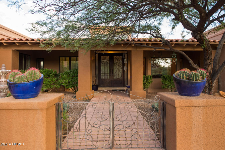 Contemporary hacienda for single or multi-generational family featuring soaring ceilings, huge bedrooms,solid oak floors on one level.Entertainment kitchen with granite counter-tops, breakfast area, coffee bar. Formal living, dining rooms, separate ''hangout haven'' family/ media room. Huge laundry room with loads of storage, double dryer. TWO SEPARATE two-car garages, one with two workshops. Split floor plan, zoned HVAC. Extra large master suite  with office, extra-large bedrooms with custom closetscapes. Large Nanny/extended-stay bedroom with private patio entrance. Oasis swimming pool patio, mature fruit trees. Central location, close to best shopping. medical care, schools, private security. This home is ready to be your home. 
Owner/agent If you have an expanding family or long-staying visitors, this warm and inviting home is the best nest for you.  The large, formal dining room  has plenty of room for everyone including  left-handed Aunt Lillie and Baby Bertha's highchair.  Hate the sight of dirty dishes after dinner?  Close the glass doors between the kitchen and family rooms and the mess disappears.  

Everyone will want to sit around the kiva fireplace in the summer or winter.  The family piano will resonate over the hardwood floors in this living room. The large, central living or family room will house the 50-friend parties or an intimate family chat with a central entertainment couch.  You can watch movies or read without the noise of the kitchen  disturbing the tranquility.  

This is the ultimate split floor plan with the oversized  private master bedroom suite anchoring one end of the hacienda.  The master bedroom features sitting areas, interior office, exercise or music room, and huge closet with shoe shelves and built-in drawers. Luxuriate in  a private master bath that is complete with a separated Jacuzzi tub and oversized  walk-in shower.  The separate water closet has a bidet as well as toilet.  Still need peace and quiet in the morning?  Enjoy your coffee in a small private patio off the master bath or install a private hot tub. 

The laundry room is a large central room with closets, storage and more.  Situated behind a custom beveled glass door, this room is designed to make washing clothes a pleasure.  

Have hobbies, love cars? Need to keep business products?  Holding  family storage stuff?  There are two separate over-sized garages attached to this home.  One separate garage  holds  three cars and still has room for  woodworking tools or an artist's workshop.  A separate interior room is air-conditioned with its own security loop to keep little ones out.  The other two-plus garage is attached to the home through the kitchen porch for easy access for groceries and loading for family trips.  Its large storage areas easily house all the garden tools, seasonal equipment and swimming pool items. 

Love the foothills, but dread the thought of driving up narrow roads, especially with young drivers growing up in your family home?  This home has parking for 25 cars on the flat, paved circular driveway.  It  is "on the way" for easy carpooling and pick-ups.  Close to the entrance of a guard-security area, this home is an easy  "in and out" for friends, but not for strangers.  

Split floor plan -- the separately zoned family wing has three large bedrooms, each with its own built in closet-scapeshleves and bathroom access. Two of the large bedrooms share an oversized bathroom with a separate room for the shower/tub  and toilet.  The third bedroom features a private bathroom with a shower and a separate private patio entrance that is perfect for a nanny, long-term guests or family.   

Connected to the family room, it is the ultimate game and media room.  Easily able to house a full-sized pool table, pinball machine, full-sized TV screen and couches, this room is the "hang out" station for family and friends.  It has huge windows and beautiful views of the mountains.  It has its own HVAC unit, entrance  and has an indestructible colored cement floor. Families will know where their children are in this house -- they will be at home.  

The back patio is a private oasis.  On three levels, the back porch floats in a private place to listen to the birds and nature.  One level down, there are mature fruit trees and a flower garden.  The lowest level where the family will enjoy the pool and sitting patio.  It's privacy makes homeowners feel like they are in a secluded garden.

A house this unique and well-priced will not last long in today's market.  There are many features to see and enjoy in  this custom-built home.  It is ready for you to move into and start being the central place for your family to enjoy.