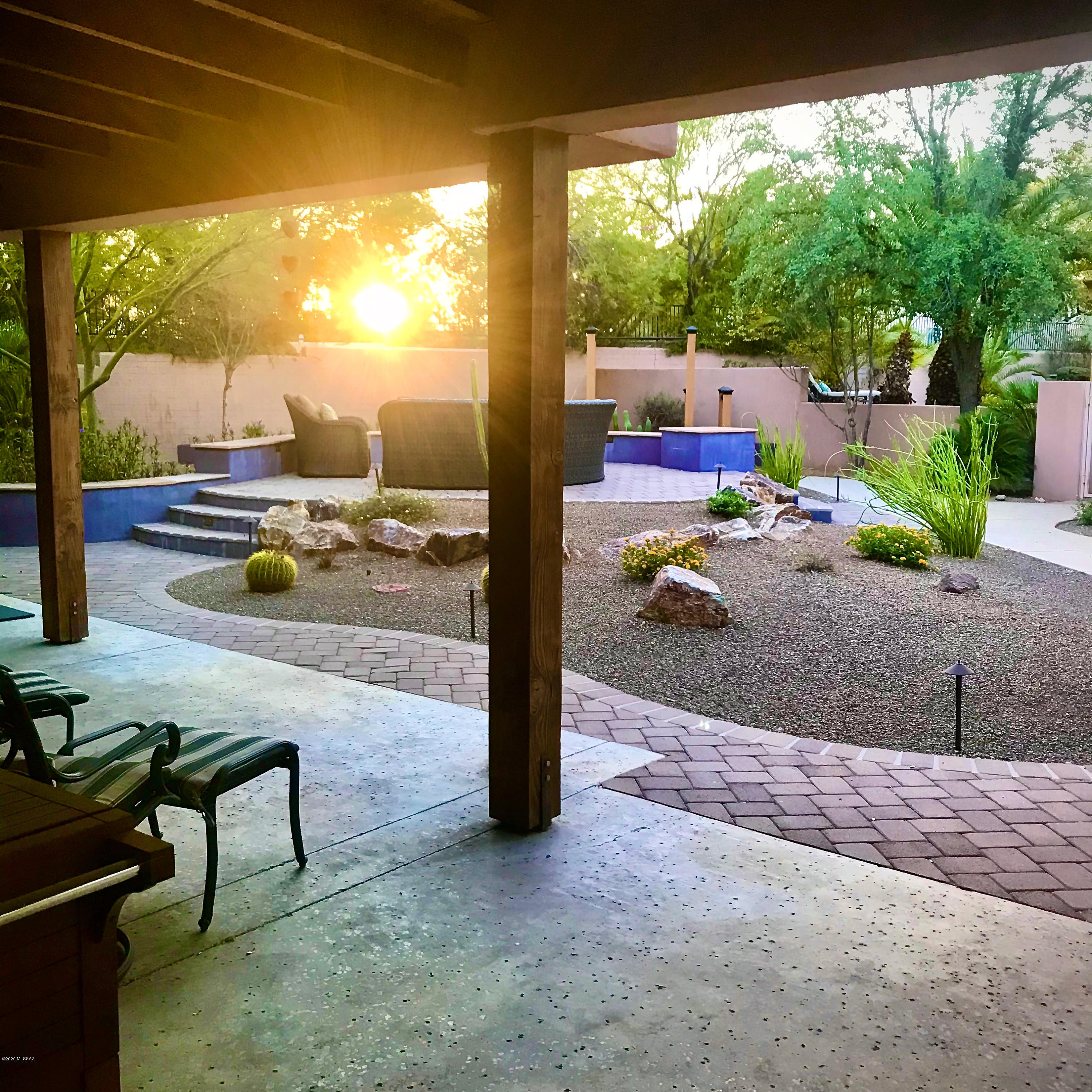 Gorgeous 1950 El Encanto Estates home, thoughtfully remodeled  with a wonderful mix of mid century details & modern upgrades. 5BR/3BA main home plus 1BR/1BA studio w/kitchenette-approx 385sf. Spacious owner's suite includes fireplace & amazing closet! Travertine tile throughout & rich wood flooring in the bedrooms. Private, half acre lot w/3 fully fenced in yards features pool (new pump & new sand filter), hot tub, beautifully landscaped grounds & 4 fruit trees. Meticulous owners w/high attention to detail have upgraded & replaced: tile roof, 4 HVACs, appliances, painted inside & out, remodeled the yard to include a raised seating area w/fire pit, Pella windows & French Doors and so much more! Near UofA, Banner UMC, downtown, restaurants, top schools & more! Owner/Agent.