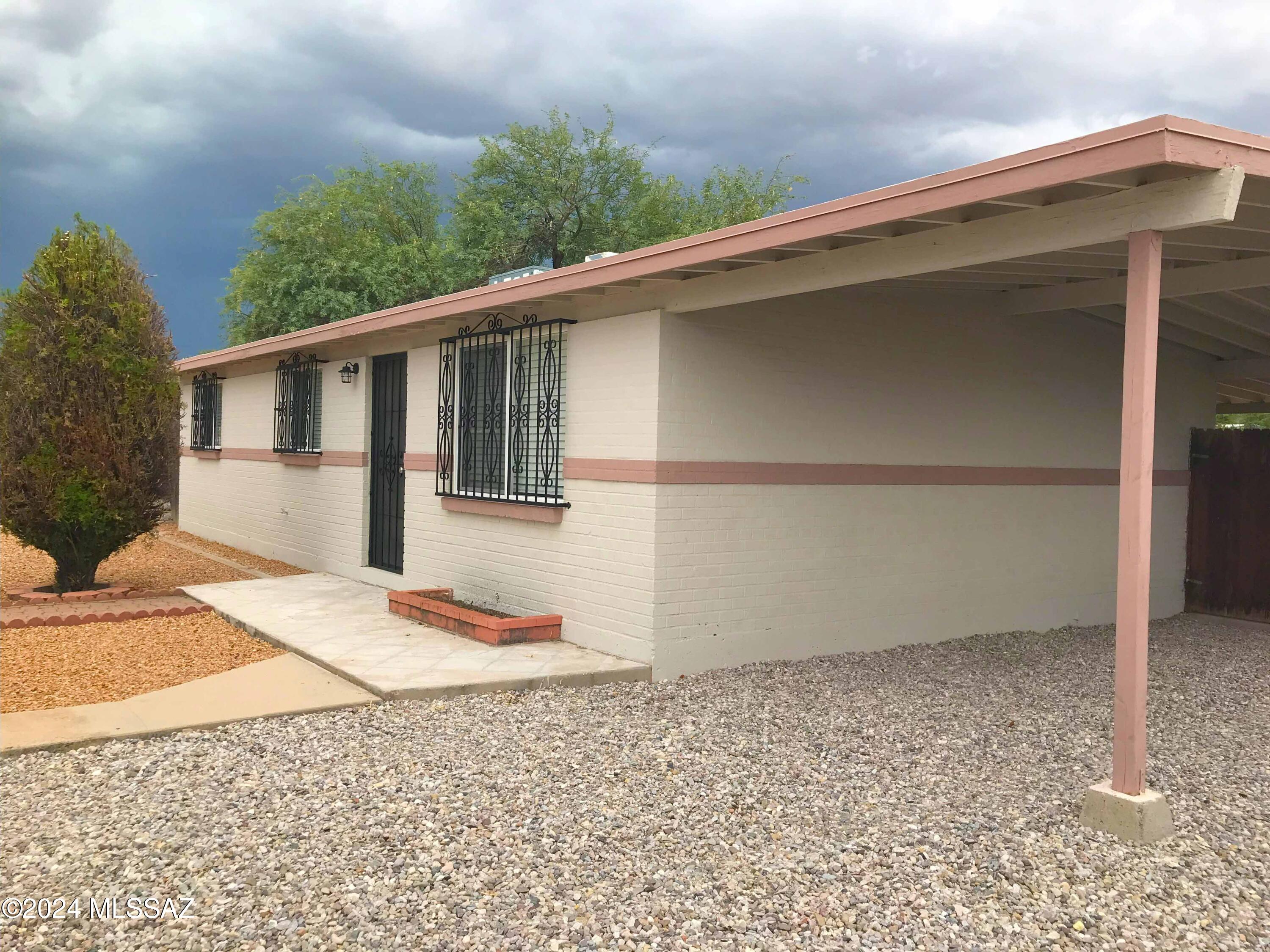This Charming renovated home features 3br/2ba & no carpet in convenient Central Tucson location. Dining area off Kitchen. Kitchen with SS Gas Oven/Stove & SS fridge. Washer & Dryer in laundry room off covered patio. Expansive covered patio & large fenced backyard with extended paver areas & a Storage Shed. Close to Super Walmart, Target, Home Depot, easy access to the UofA, Banner Medical Center, downtown & freeway. 2 small dogs Ok. No Cats. This is a must see! Non Smoking Home. Renter's Insurance required. Min 12 month lease term.
