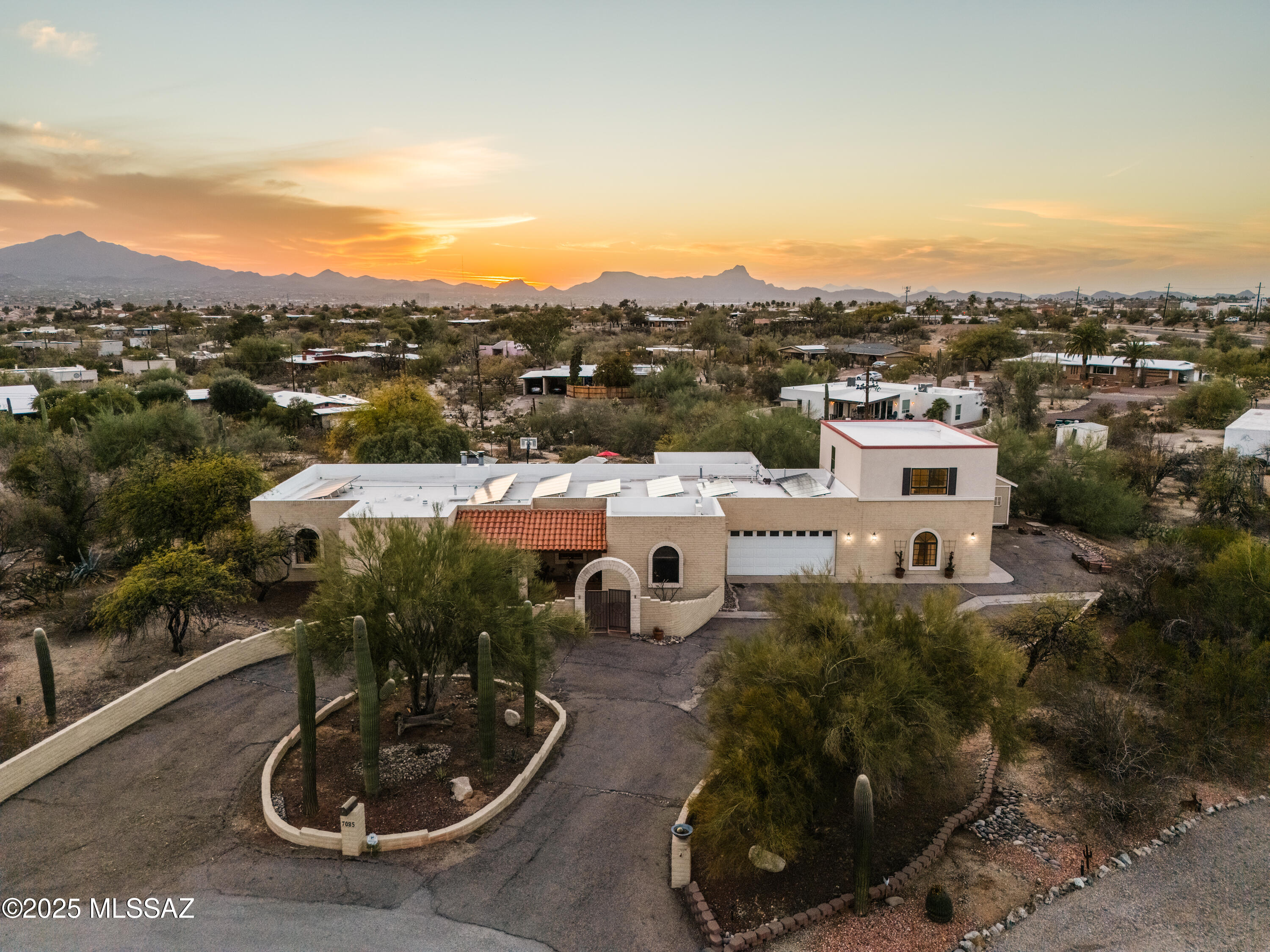 Enjoy the ultimate blend of space, privacy, and modern luxury on a serene 1-acre lot in Casas Adobes. The expansive 3,168 sq. ft. main house offers 5 bedrooms, 3 bathrooms in a split plan with bonus office space, creating an open, bright layout perfect for relaxation, work and entertaining. A 2022-completed 2-story guest house provides an additional 1,352 sq. ft. of living space with a full kitchen and 1.5 baths - ideal for guests, rental income, or a private retreat. Resort-style amenities including a sparkling pool, basketball court, and outdoor sunset views. Owned solar adds energy efficiency. Roof freshly coated and brand new tank-less water heater installed in March 2025! This exceptional property is a rare find - spacious, versatile, and updated for modern living.