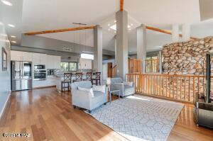 4bed/4bath/4202sq.ft. home w/ 4car garage nestled in the Foothills on 1.09 private acres w/ stunning city, mountain & desert views. Soaring 16' beamed ceilings, soothing palette, Brazilian cherry hardwood, tile floors & marble steps. Magnificent natural stone fireplace opens on 2 levels. The heart of the home is the chefs kitchen w/ a center island, granite counters, tiled backsplash, breakfast bar, SS appliances, & wood cabinetry w/ hardware. Fabulous views from all windows! Patio access from living room w/ plenty of space for outdoor entertaining. Bonus/Media Room w/ so many possibilities. Generous size bedrooms & upscale bathrooms w/ designer touches. Like having your own staycation? You'll love the relaxing yard setting w/ sparkling pool, spa, covered patios/balconies. Welcome home!