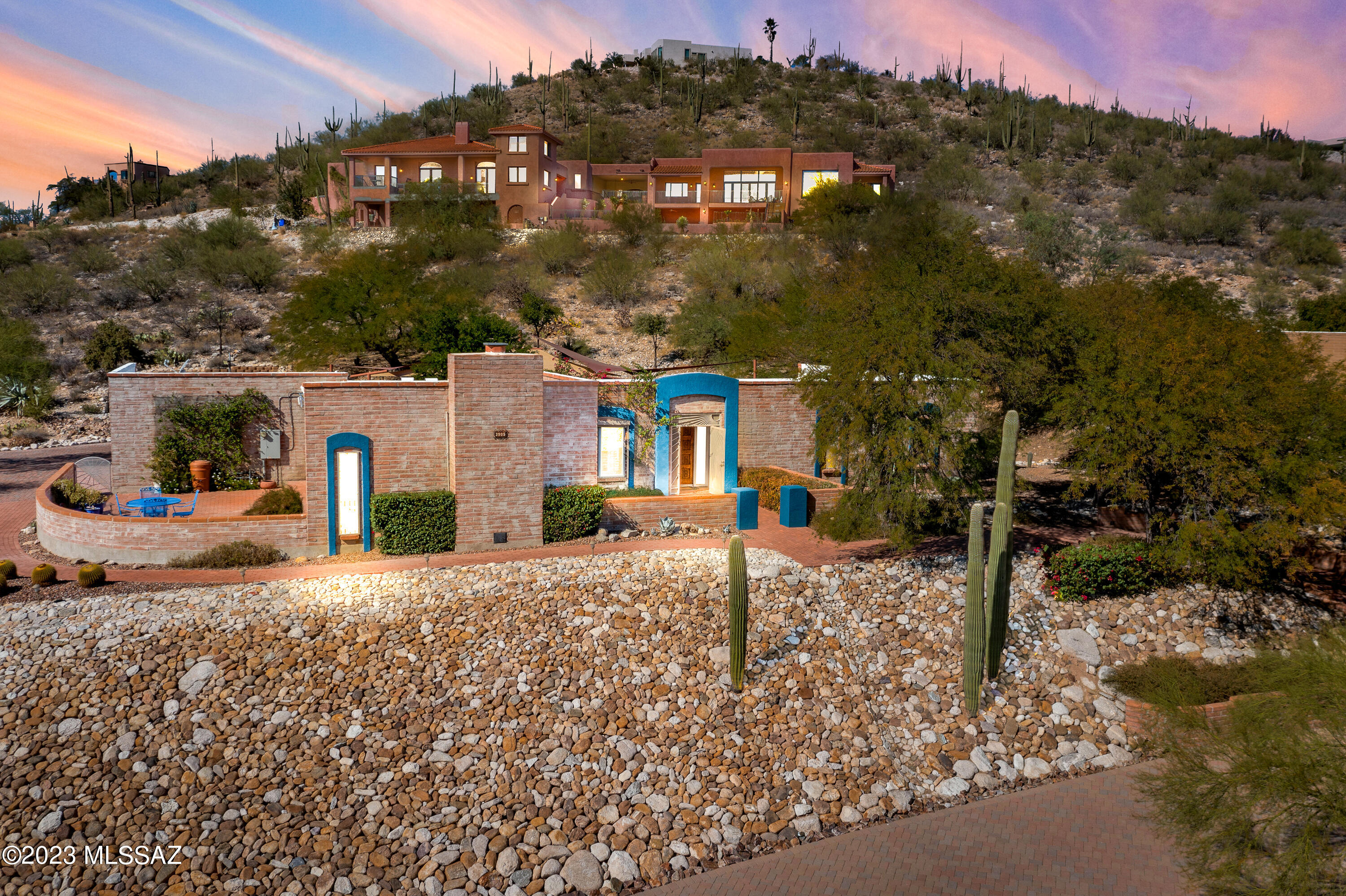 Situated in a sought-after neighborhood, this property boasts a prime location with an elevated lot to enjoy the breathtaking views of the city and tranquil sunset evenings. This exquisite property offers a unique blend of Southwestern charm and modern comfort, making it a perfect place to call home. The kitchen is a dream, complete with Quartzsite countertops, stainless steel appliances, and large island. Embrace the Arizona lifestyle with a stunning backyard that includes a private covered patio. The mature desert landscaping and mountain views make it a serene retreat for both relaxation and entertaining.
Enjoy the tranquility of the Catalina Foothills while being just a short drive away from downtown Tucson. You will be amazed by every finishing touch, nothing was spared.
