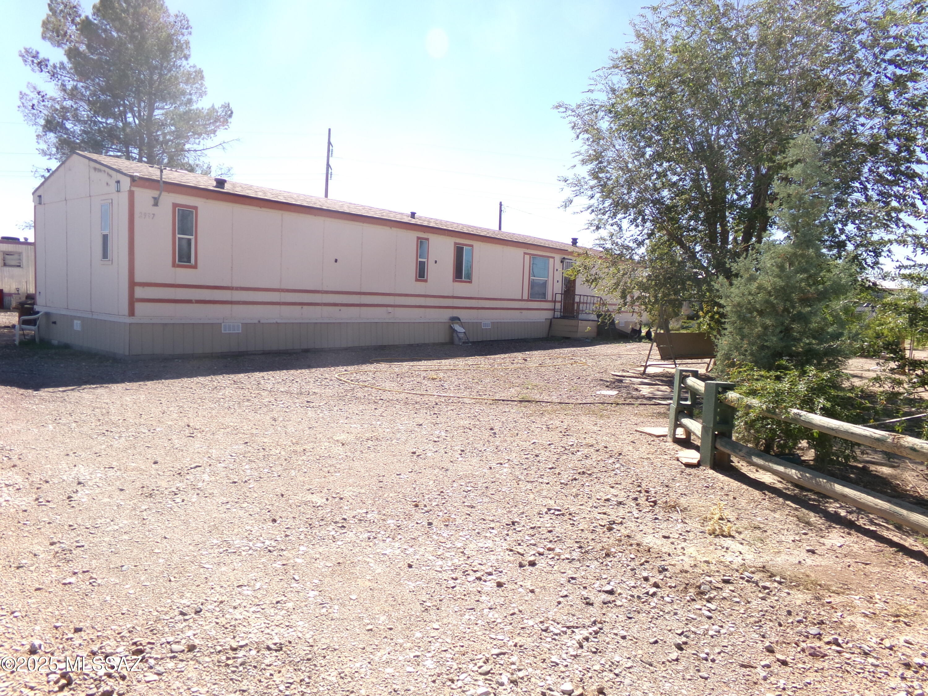 Three BR two BA single wide 1996 manufactured home on .87 ac. Horse property about 3 miles outside the city limits of Willcox, AZ.  Country living and close to town.