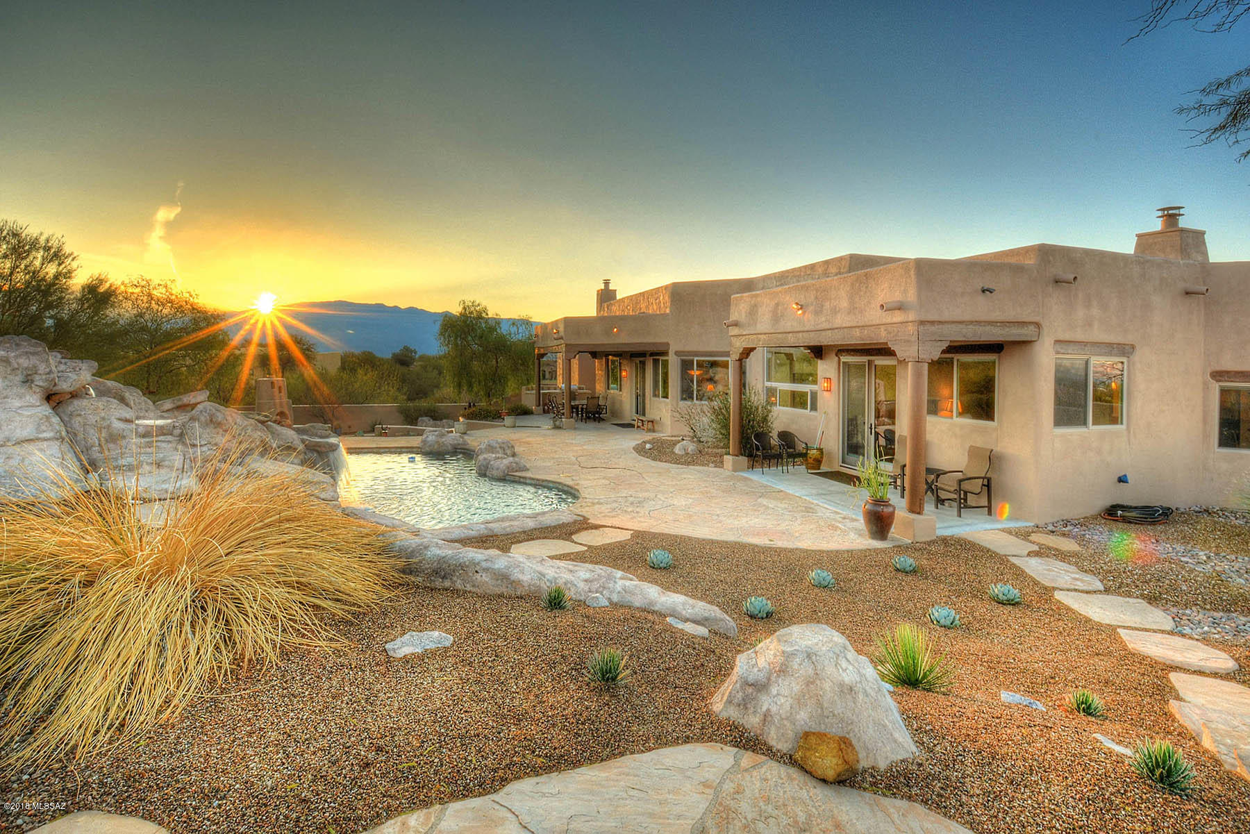 Beautifully Updated Custom Home w/Spectacular Views & Every Amenity You Would Expect in Your Forever Home. Incredible 360-Degree Views of the Catalina, Rincon & Tucson Mountain Ranges & City Lights too. Exclusive Gated Neighborhood, 3555 SF, 4 Bedroom, 3-1/2 Bath Home Includes a Fabulous Guest Suite. This Santa Fe Style Home Features Wood & Viga Beam Ceiling in Living Room, Travertine Flooring, Beautiful Cherry Cabinetry & Granite Counters Throughout, Family Room w/Beehive Fireplace & Large Master Suite w/Double-Sided Fireplace. Abundant Windows Capture Mountain Views from Nearly Every Room. Pebble-Tec Pool & Spa w/Fun Pool Slide, Flagstone Patios, Built-In BBQ & Oversized 3-Car Garage. Fabulous 1.65 Acre Hilltop Location in Northeast Tucson in the Highly-Rated Tanque Verde School Dist.