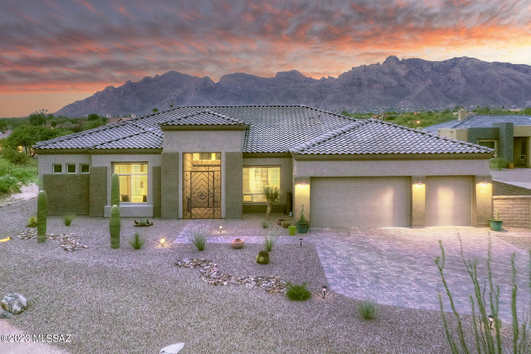 Sought after and Rarely Available--Built in 2021-Gated-Foothills-3 Bedroom PLUS Den-One level-NO steps-Panoramic Mountain Views on 1+Acre. Built for seller by AF Sterling with upgrades and enhancements galore.(List is attached with Floorplan under Documents)-Split Bedroom Plan-Wonderful Primary Ste with huge shower(dual shower heads/beautiful tile) ,separate make up vanity, enormous closet. Great Room features huge windows that showcase the Catalina Views, linear modular Gas Fireplace-Spectacular Ceiling Height-Formal Dining Room. Oh my, this Kitchen is exactly what you would have selected: Top End KitchenAid 5 burner Gas Cooktop, Oven with Air Fryer Wi-Fi, GE 4 Dr Fridge 27.9 Cfeet,Blanco Sink with low separation-DW is Energy Star as are most-Quartz + Granite tops and back splashes, too! Back yard: Extended Paver Patios.  Quality Hot Tub by Sunset Spa. Remarkable OutDoor Kitchen has 5 Burner Gas BBQ w/one infra-red burner. Heavy duty Outdoor Refrigerator, Sink, Bar Seating, Serving Counter and Drawers, too(Installed by BBQ Guys). Section of Artificial Turf, specimens cacti--all done by professionals!
The garage has Batt insulation, a work bench the tool closets at each end-2 Foot garage extension, Door to the back yard, Even a TV Pre-wire. Other Extras: Gutter system, Wrought Iron Security Door, Flood lights, Reverse Osmosis at Kitchen Sink, Water Softener--AC and Furnace upgraded to 16 seer.