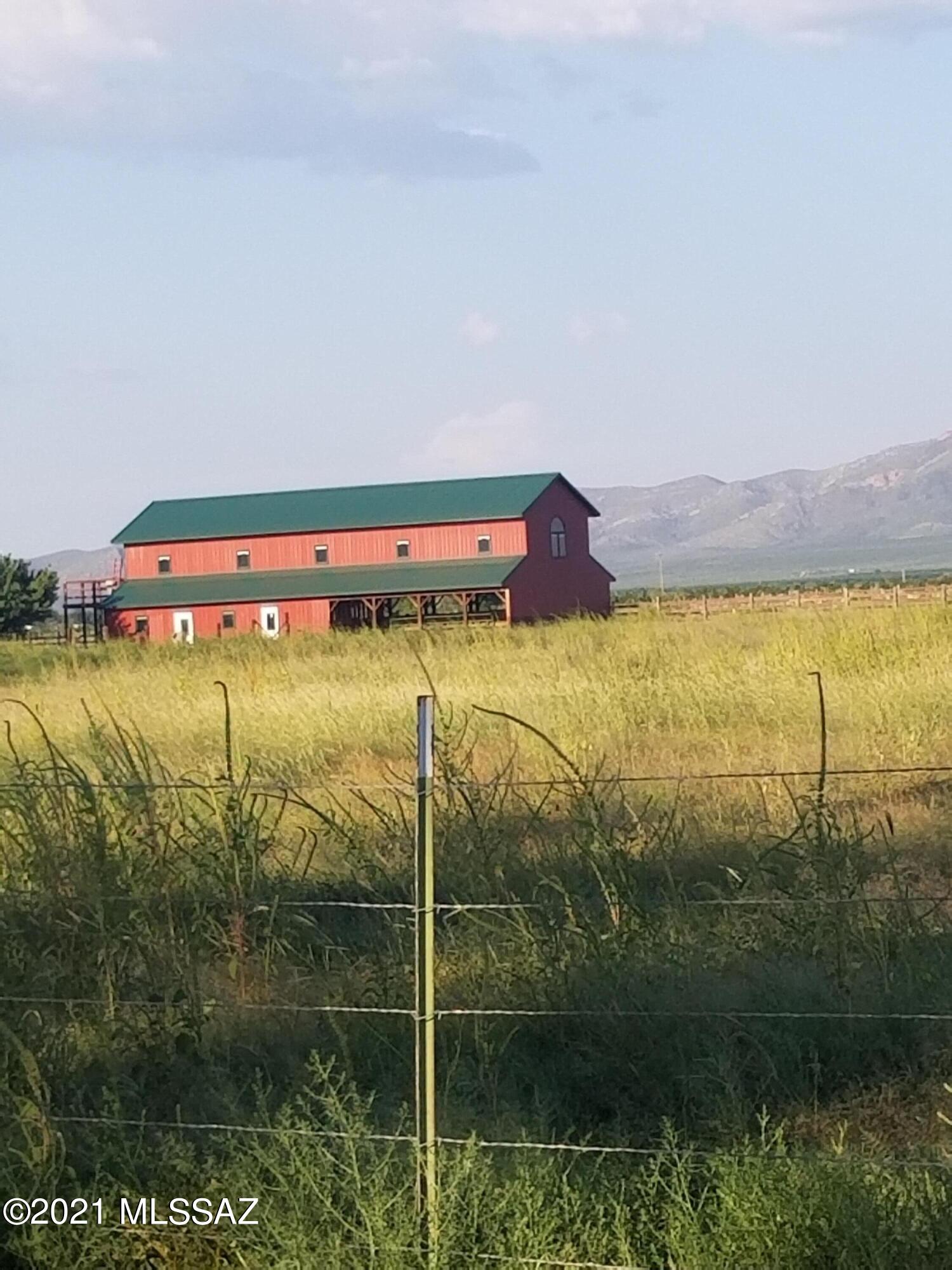 This 80 ac property overlooks the Swisshelm Mnts. This completely fenced property  begins with a tree lined driveway that leads to a well established ranch that features producing apple & peach trees, hay fields, horse corrals with irrigated pastures & new fencing. This unique property features a main house, guest house, shop, 2 barns and many outbuildings.  The 3092 sq.ft main house includes 2.5 baths, 3 bedrooms with a combination of tile & hardwood floors. The gourmet kitchen includes double sinks, high end stainless appliances, cherry cabinets & double  pantries. There are also two living areas, a wood stove, sun room, office & formal dining room. The enclosed court yard leads to a 568 sq. ft. guest house with tile floors, kitchen, dining area, large sleeping area &  full bathroom. Also located on the property are many outbuildings all metal with steel roofs. There is a whitewashed 12 ×18 he/she shed with kitchen and heating and A/C split unit. There is a 18x20 bunkhouse with shower, sink and heating A/C unit, double pain windows and attached storage area. Animal areas include a 2 story chicken coop with fenced enclosures, pig barn with electricity, automatic waters, piggie pool and storage. There is also a 4 stall goat/horse barn with water and electricity that connects to a pasture with automatic waterier. Also on the property is a 40×30 shop with roll up doors, electric, lighting, 8x8 walk in cooler and covered parking. Last but not least, there is an unfinished 2 story 1440 square foot barn.  The 36x72 bottom floor has been framed out for a tack room, bathroom, laundry, bunk room,  and feed room. The stairs lead to a 20x72 open area with double pane windows and french doors that lead to a deck that overlooks the 80 acres. Property has 2 registered wells, 1 domestic and 1 irrigation. Owner will sell additional 81 acres with 2 wells next door. Call today to make an appointment to tour this beautiful property.