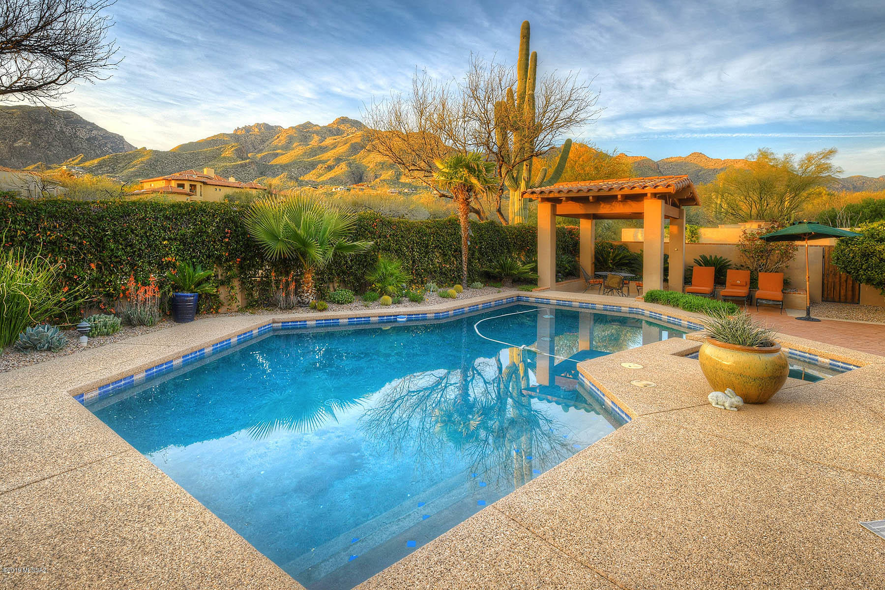Beautifully Custom Home on the 7th Fairway of the Ventana Canyon ''Canyon'' Golf Course. Charming Courtyard Entry. 3 Bedroom & 3 Bathroom, Separate Office/Den and Additional Office/4th Bedroom. Formal Living Room with Vaulted Ceiling, Stone Gas Fireplace & Oversized Glass Sliding Door. Gourmet Island Kitchen w/ Granite Counters, SS Appliances & Breakfast Bar Opening to Family Room & Dining Area w/ Vaulted Ceilings, Stone Gas Fireplace and Custom Built-Ins. The Master Suite Features Vaulted Ceilings, Oversized Glass Sliding Doors, Bath with Separate Tub & Shower and a Large Walk-In Closet. The 3 Car Garage Includes a Separate Heated & Cooled Storage Space. Resort Like Backyard w/Pool, Spa, Ramada for Outdoor Dining and Spectacular Mountain and golf Course Views!