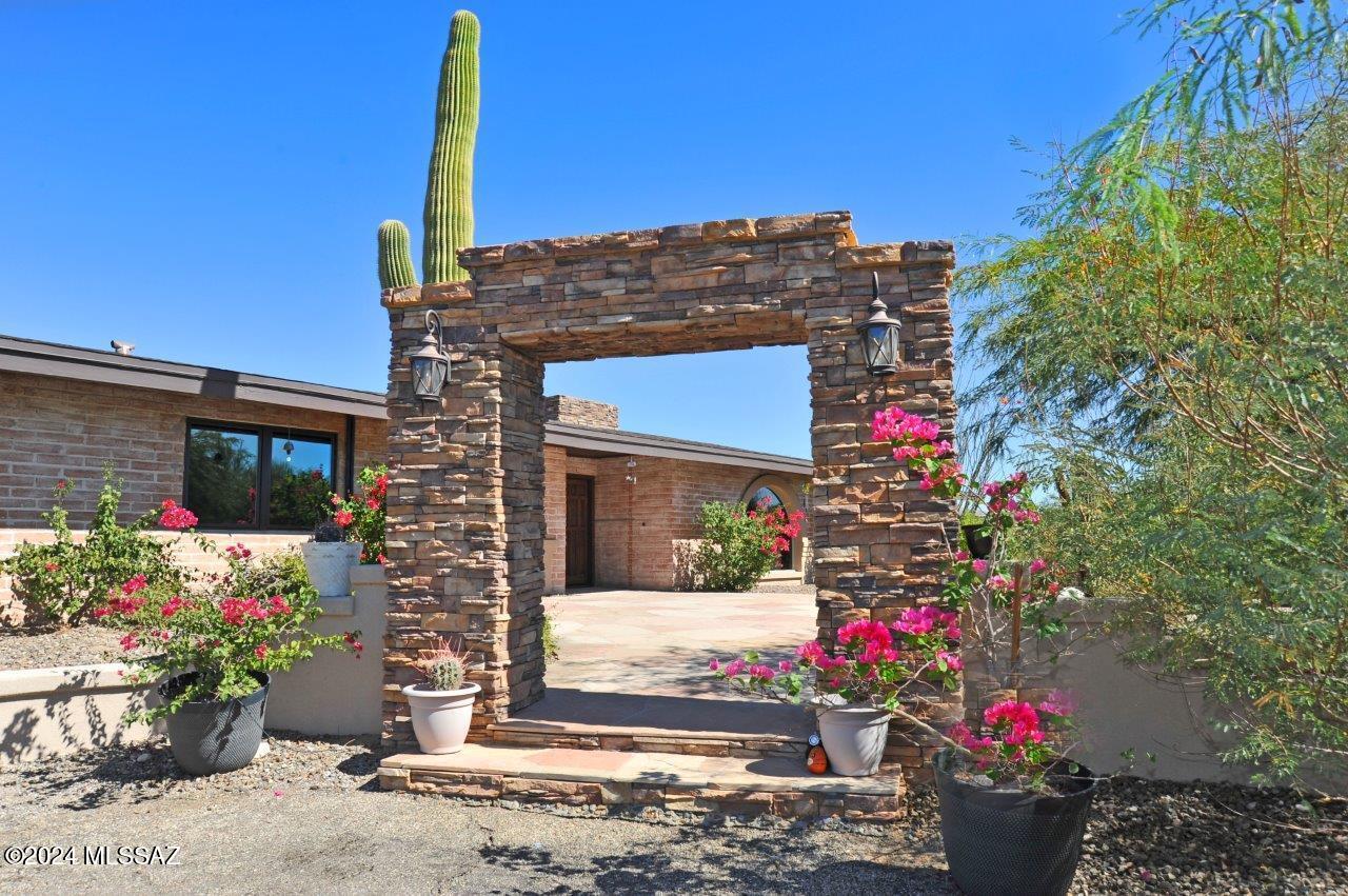 Stunning remodeled Skyline Bel Air Estates home with panoramic city and mountain views. This beautifully remodeled 3-bedroom, 3-bath, adobe home with RV garage/workshop, offers an open floor plan with see-through fireplace. Spacious walled backyard with gazebo, fireplace, and a variety of citrus trees. Enjoy panoramic views of the Catalinas.  An attached 2-car garage also has an adjacent craft room.
 Private, yet near shopping, restaurants and located in the Catalina Foothills school district.