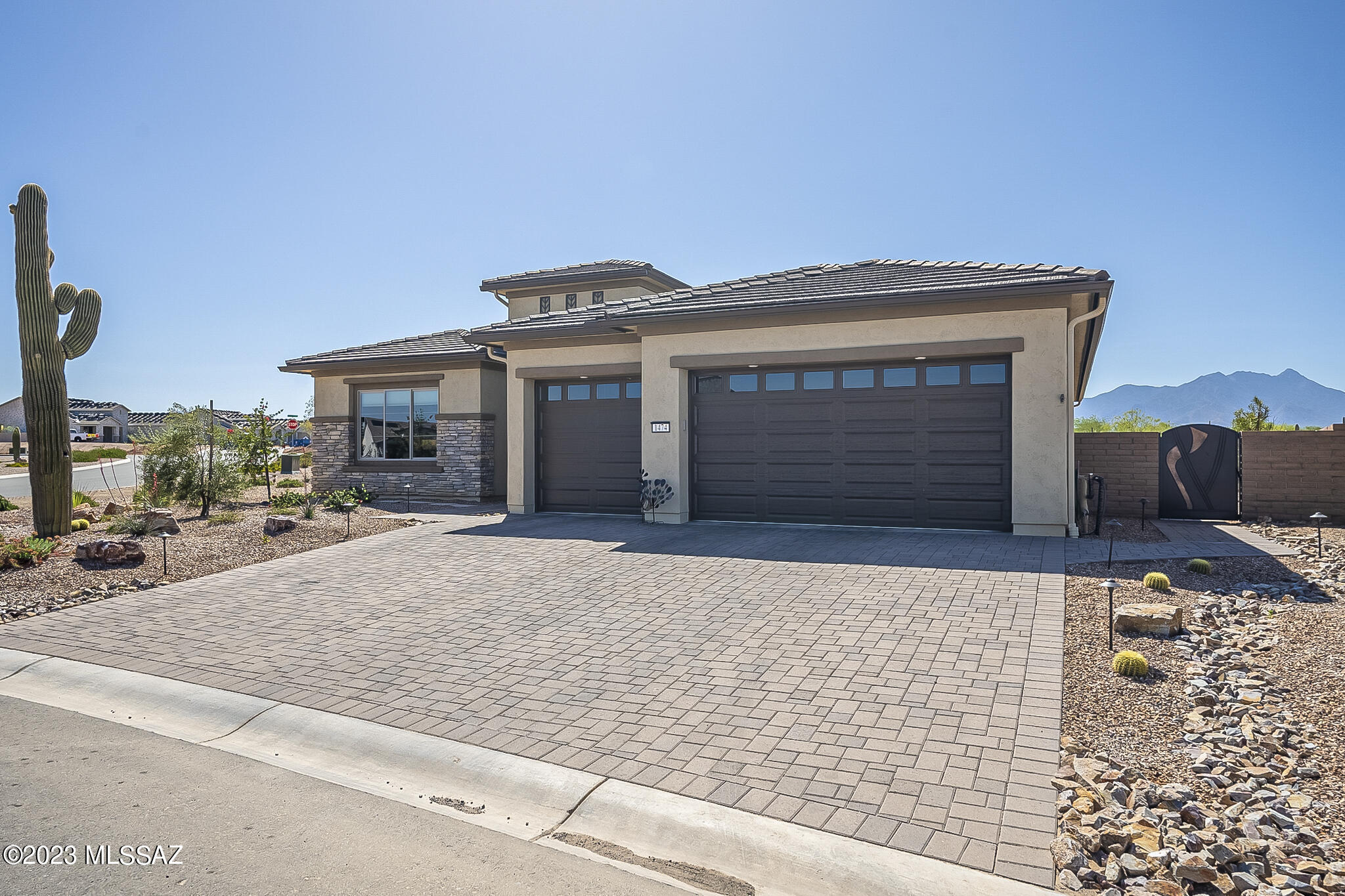 Quietly Sophisticated with the Best Upgrades in all of the right places ... this 2,385 SF EXTENDED VIENTA home floor plan is a ONE OF A KIND Desert Sanctuary in Quail Creek! From Custom Subtle Paint Faux Finishes to Upgraded Cabinets, Granite and Quartz Countertops, Blanco Undermount Kitchen Sink, Exquisite Lighting, Tucson Rolling Shutters, Patio Door by Anderson, Carpet, Wood Plank & Ceramic Tile Flooring, California Custom Closets, Curb Less Primary Bath Shower, Gutters, 4 FT Extended Garage w/Epoxy Coating, 2 SolaTubes Daylighting System, Driveway Pavers, Exquisite Pool & Hot Tub and Fabulous Private Mountain View.  You will never want to leave home! Entertaining friends and family will be an absolute joy utilizing all of your countertop spaces, tons of cabinets and wet bar.  See More When it is time to go outside you will be living the Country Club lifestyle in your elegant Oasis Hot Tub and Pool surrounded by Travertine Tile and Private Panoramic and Mountain Views. Built in 2021 w/$147k in builder options and $185k in after-build upgrades.  Robson Warranties transfer.  Don't wait years to build new and pay higher prices in the process.  See the Documents Section for a list of upgrades.  This home is waiting for you and very well may be the last home you will ever want to buy!