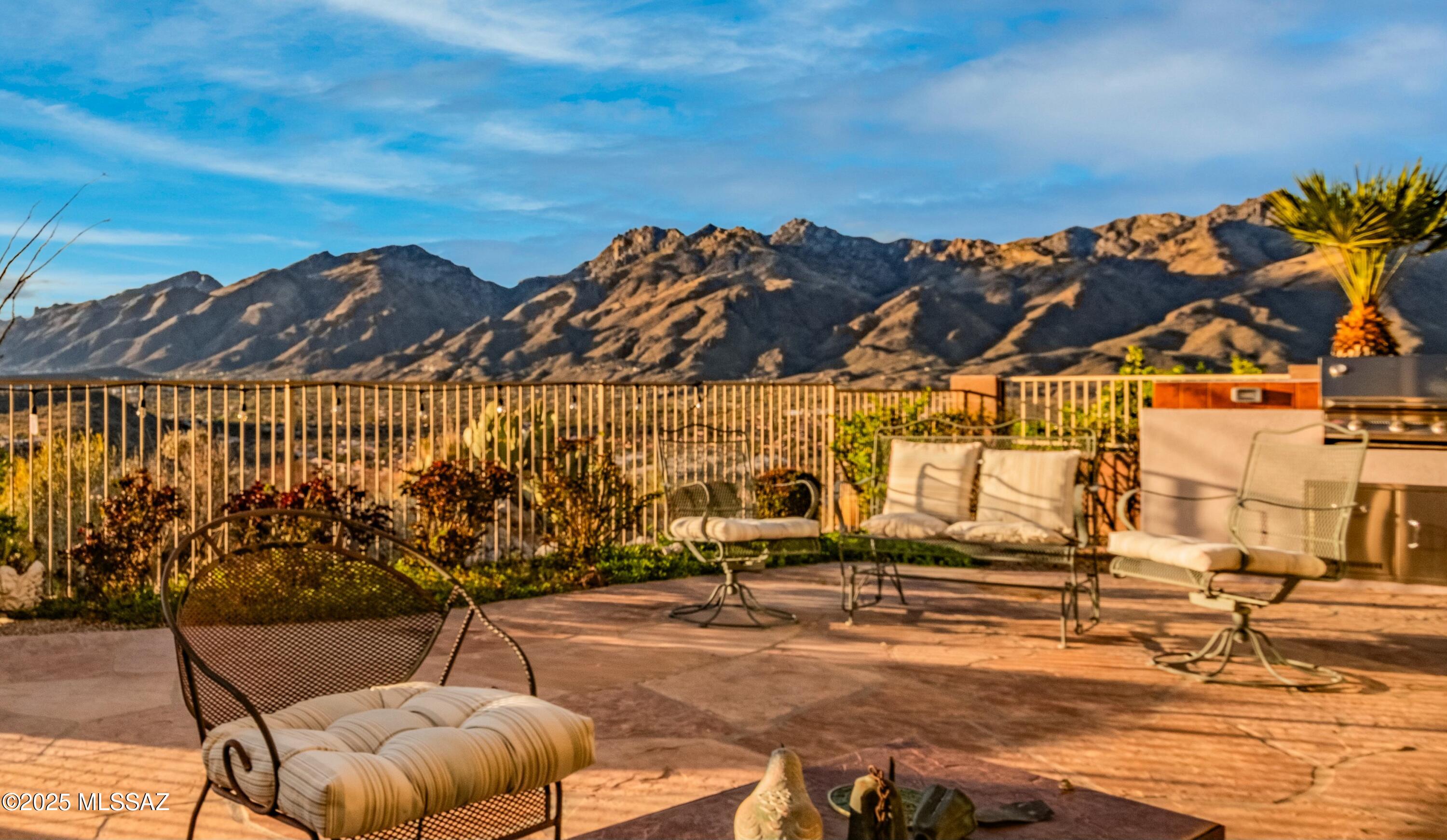 View the stunning sunsets & Catalina Mountains from the west patio, & enjoy morning coffee & the Rincon Mountains from the east patio, a rare opportunity! This split 2 bedroom plus office (third bedroom) home has a GREAT ROOM, on a short cul-de-sac street, on the highest point of the ridgetop of spectacular gated Sabino Mountain. You can see the city lights! & CLOSE-BY mountain views from every room! The high ceilings in the great room offer a relaxing atmosphere for entertaining friends & family. Sabino Mountain offers a clubhouse for residential private use, & heated swimming pool & spa. Similar homes on the same street have recently sold within eight days! Hike Sabino Canyon one mile away, great shopping, fine dining, golf & close to Tucson Medical Center Hospital. You will love it!